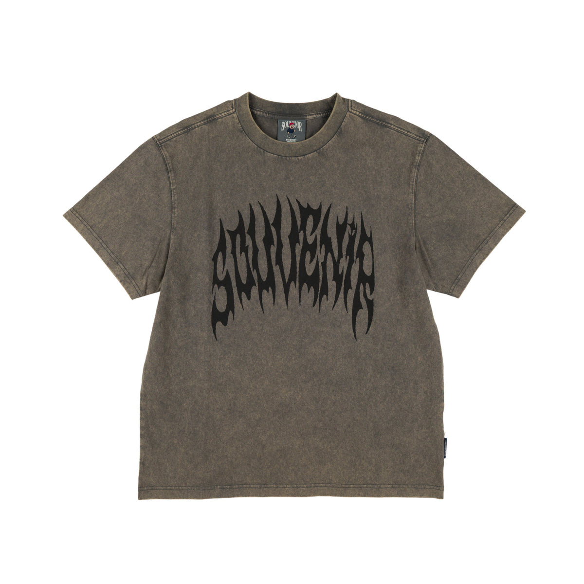 A washed dark brown t-shirt with a black gothic-style 'souvenir' graphic printed across the chest, displayed flat against a solid white background.