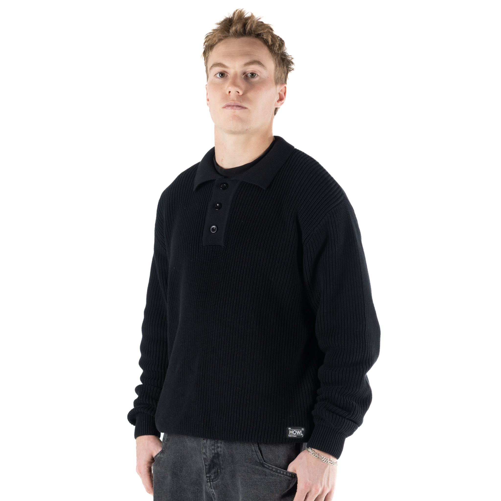 Black Howl Heavy Knit Polo shirt for men and women, featuring a textured knit fabric and classic polo collar.