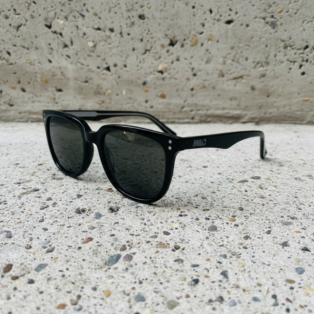 Black sunglasses with reflective lenses on a white background