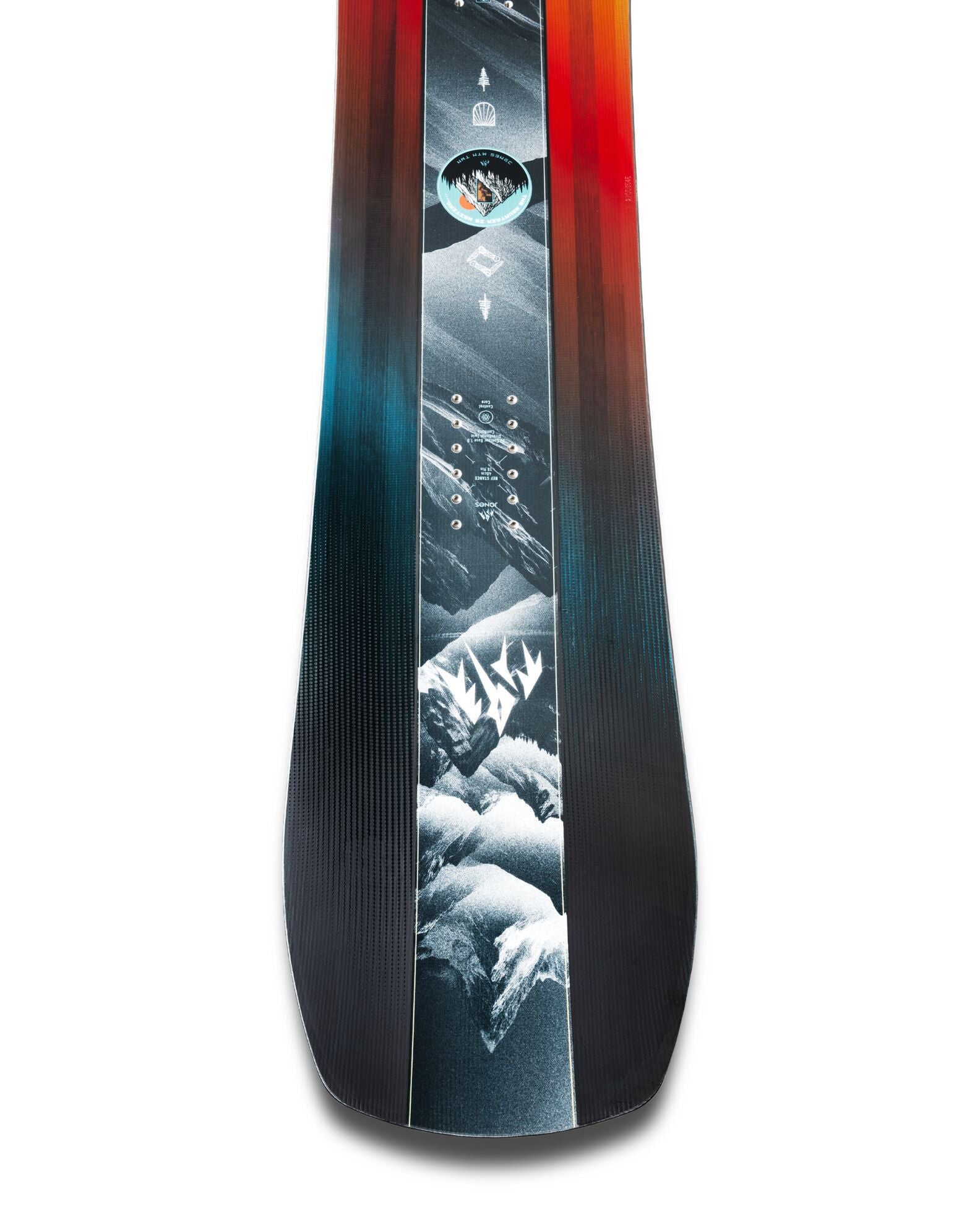 Jones Mountain Twin Junior snowboard in snow, showing the tail shot with graphics and design details.