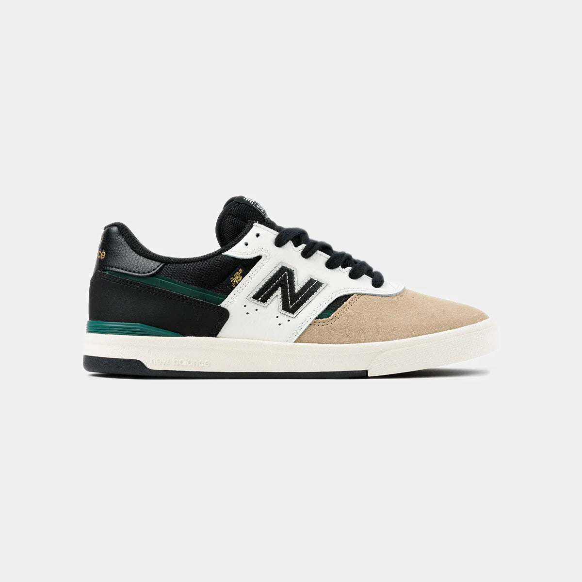 New Balance Numeric 306 Cup Foy skate shoes in beige and black with sleek design and sturdy construction.