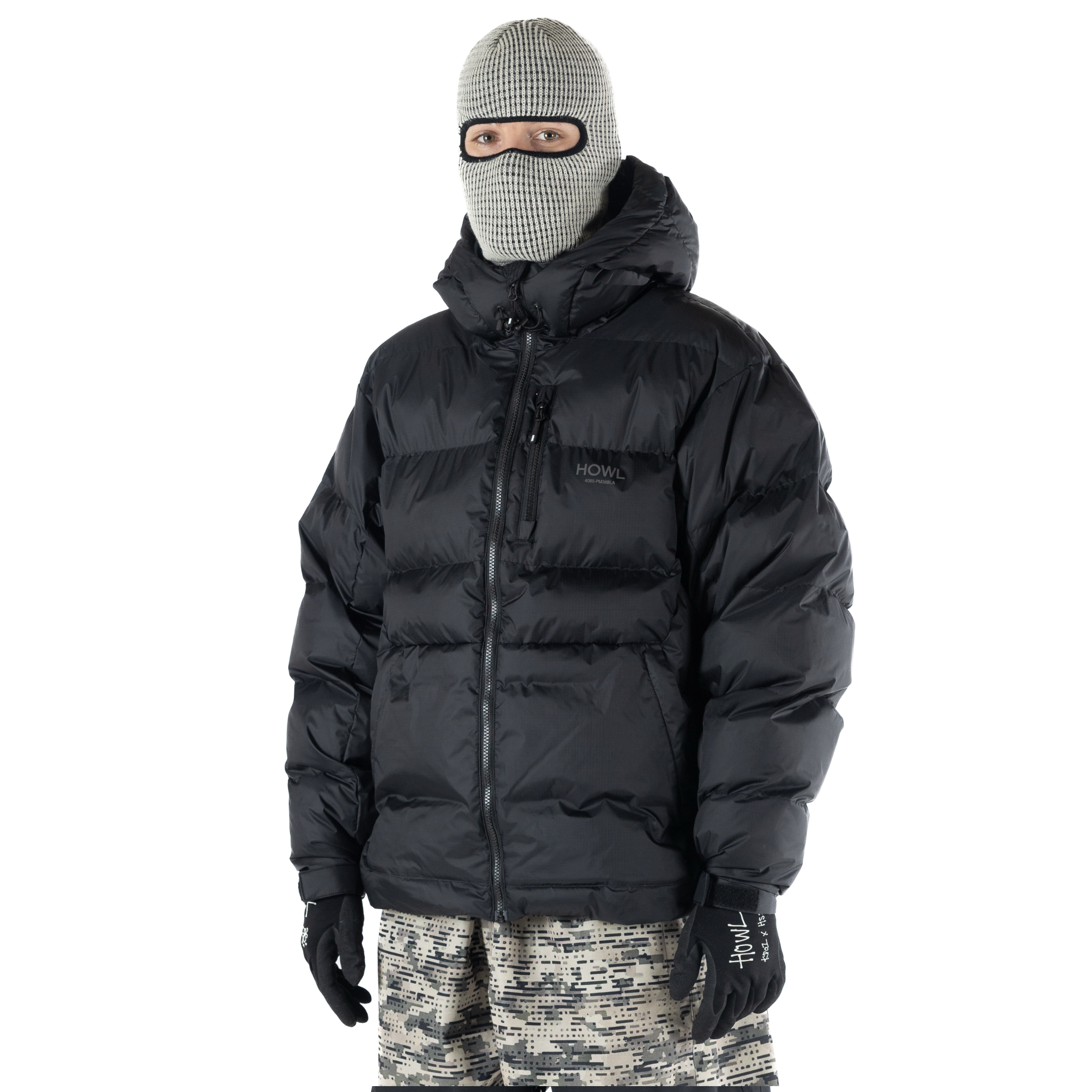 Black Howl Puffy Jacket for men and women, showcasing its quilted design and cozy insulation.
