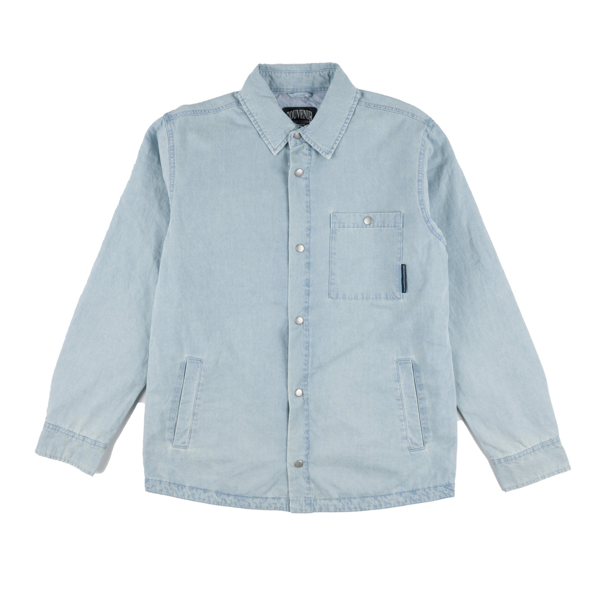 A light blue souvenir denim shirt jacket with a button-up front, pointed collar, a chest pocket with a snap button, and two front flap pockets, shown flat on a white background.
