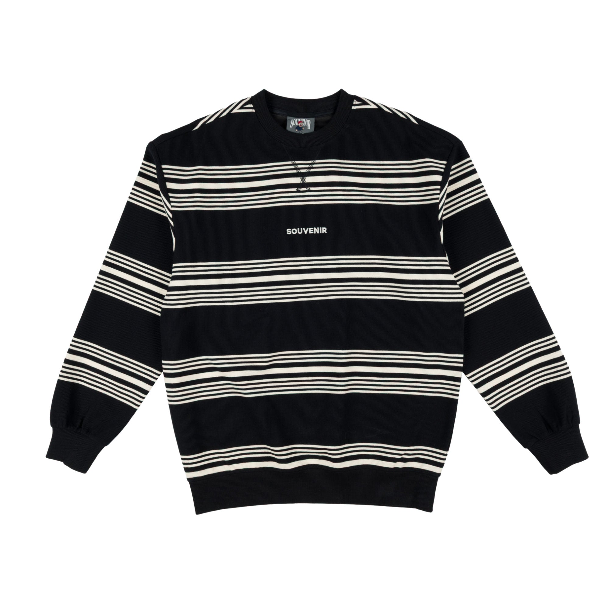 A black and white horizontally striped long-sleeve sweatshirt with 'SOUVENIR' printed in white on the chest, displayed flat against a white background.