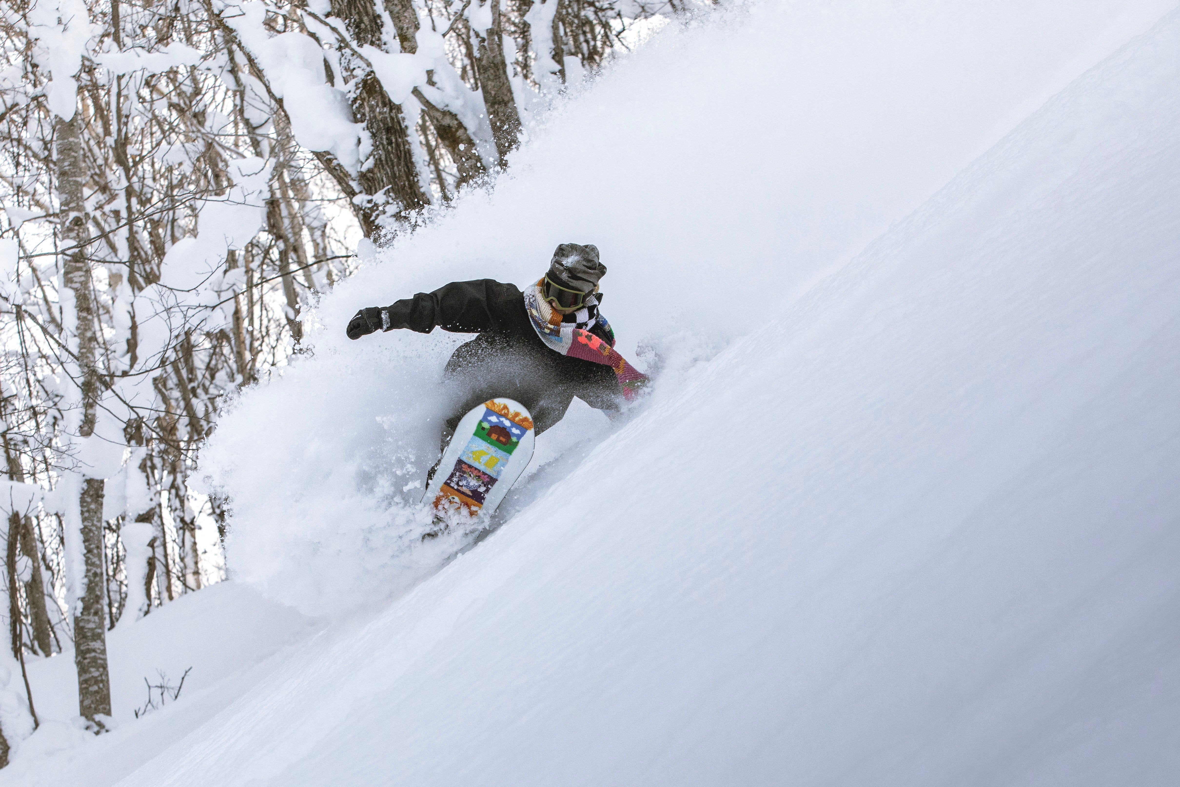 Armada Do Si Do women's snowboarding snowboard with a vibrant design, featuring Stefi Luxton on a snowy mountain background.