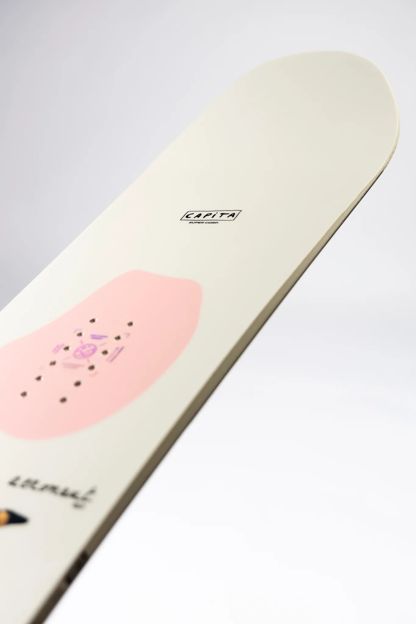 Capita Aeronaut Snowboard 2027 in winter setting, showcasing the snowboard's design and graphics on a snowy landscape.