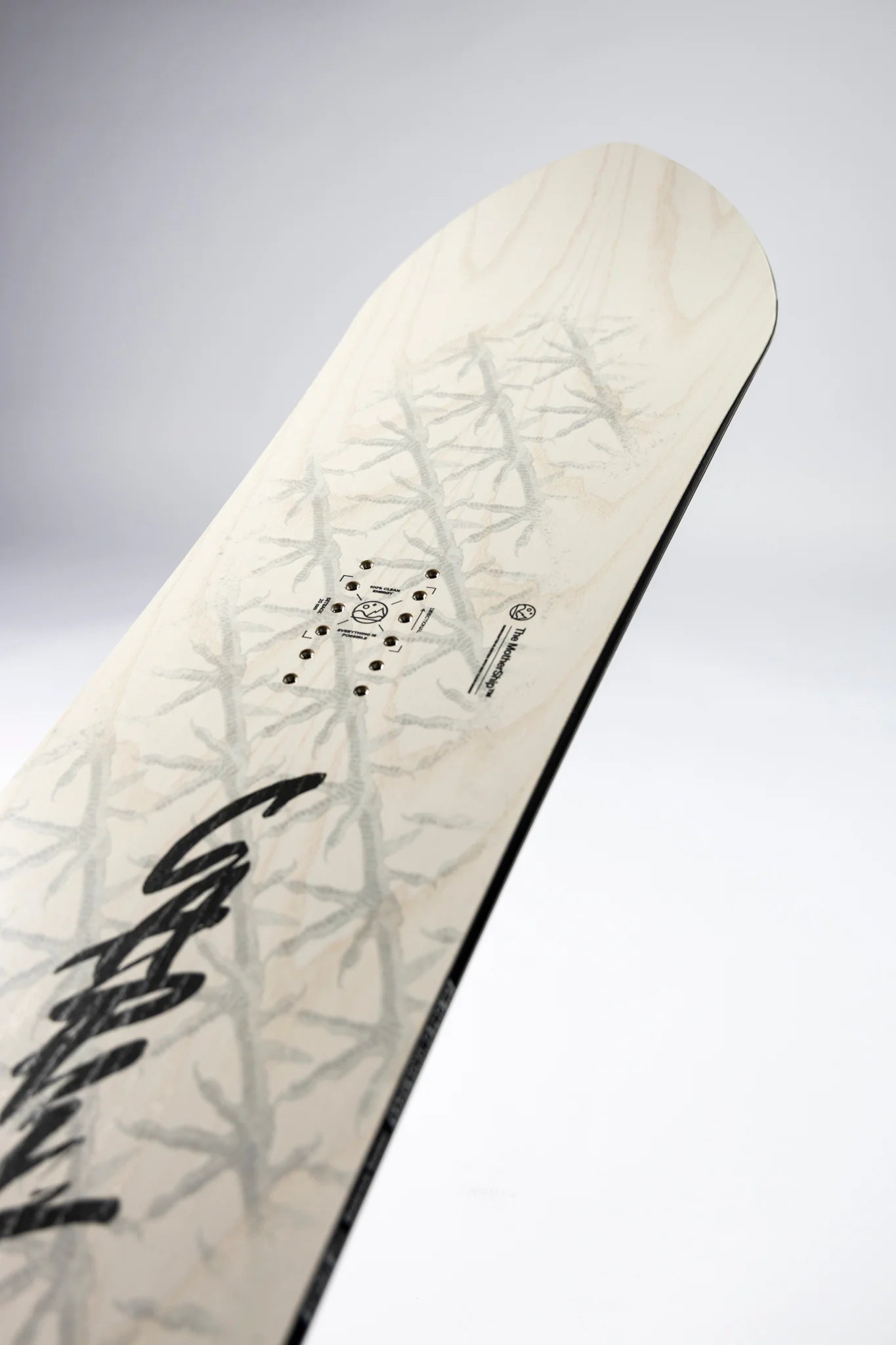 Capita Kazu Kokubo Pro Snowboard 2027 in snow, showcasing the board's graphic design and shape on a snowy surface.