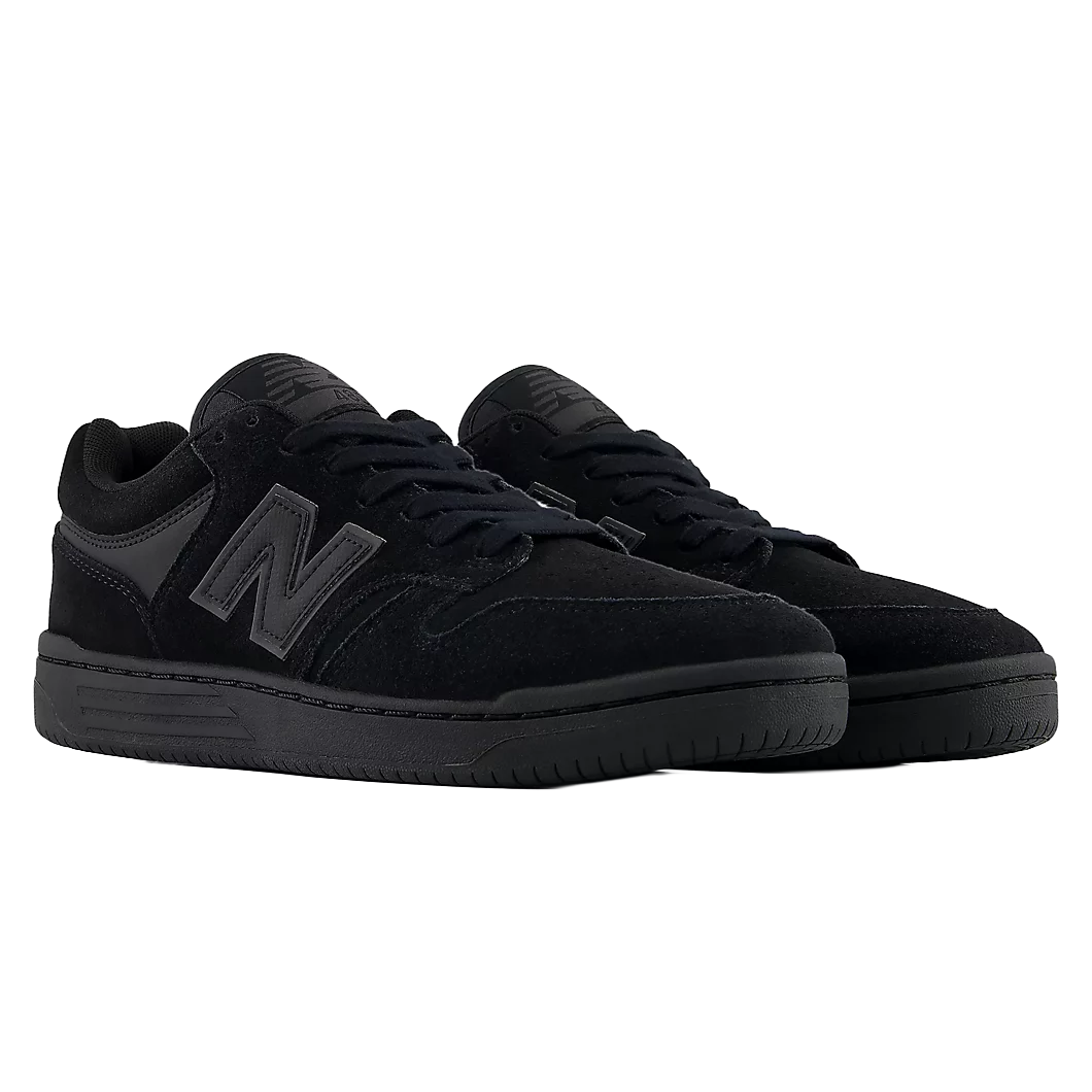 Pair of New Balance Numeric 480 skate shoes in Black and Black shown from a front three-quarter angle.