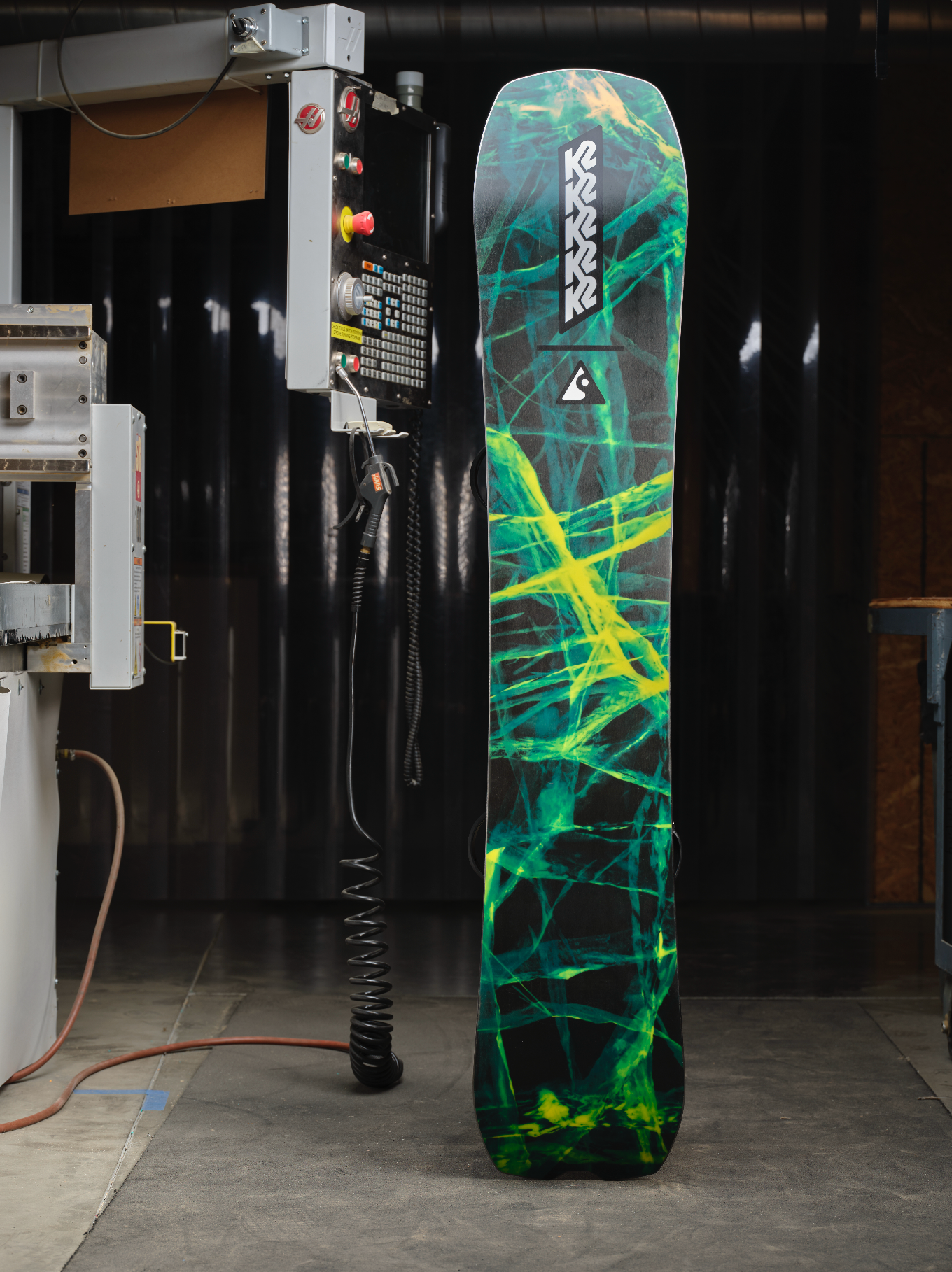 K2 Alchemist snowboard base graphic featuring vibrant design and branding, designed for all-mountain snowboarding in 2027.