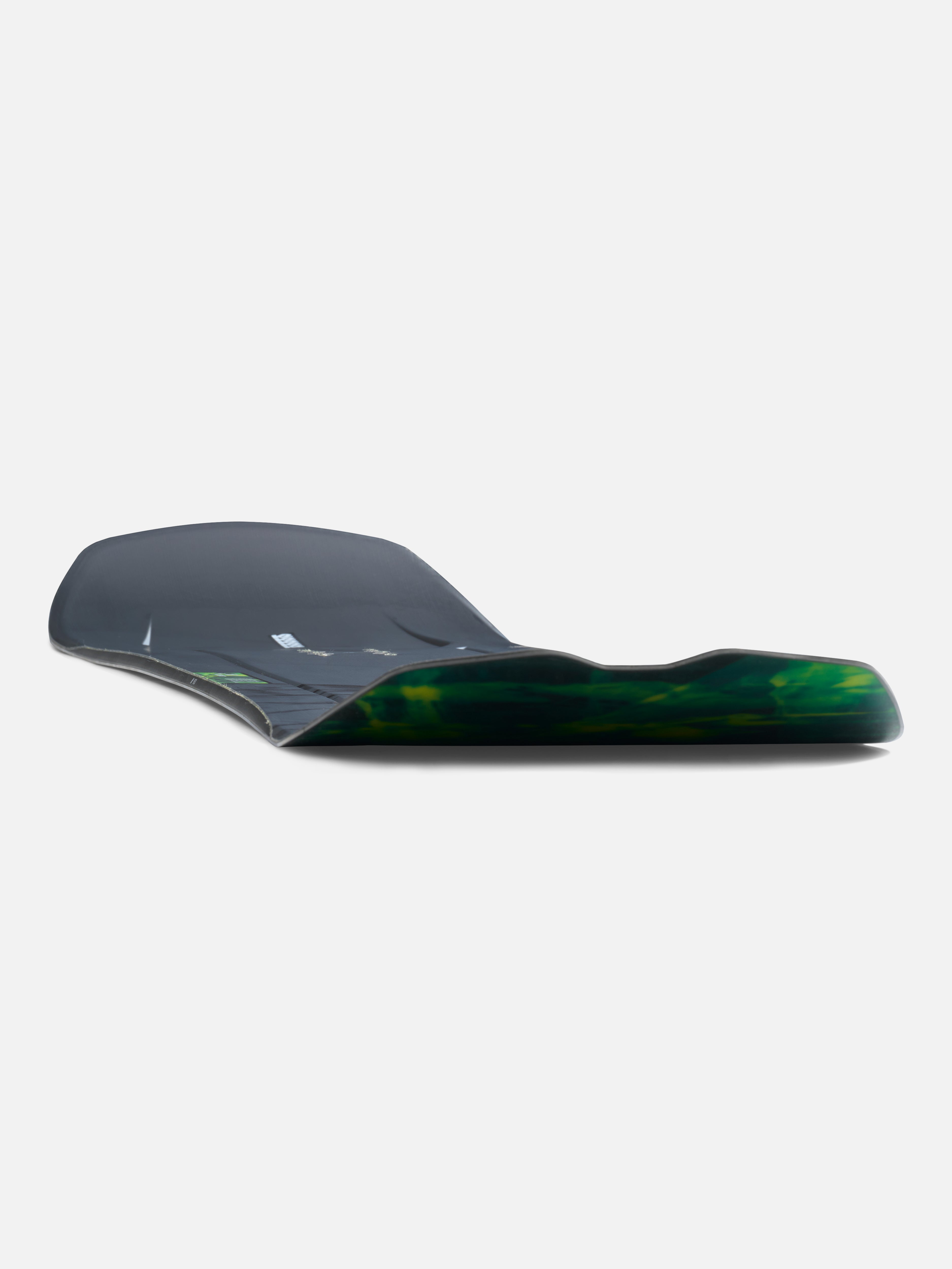 K2 Alchemist snowboard for 2027 with a low-angle view, showcasing the design and graphics of this versatile snowboarding gear.