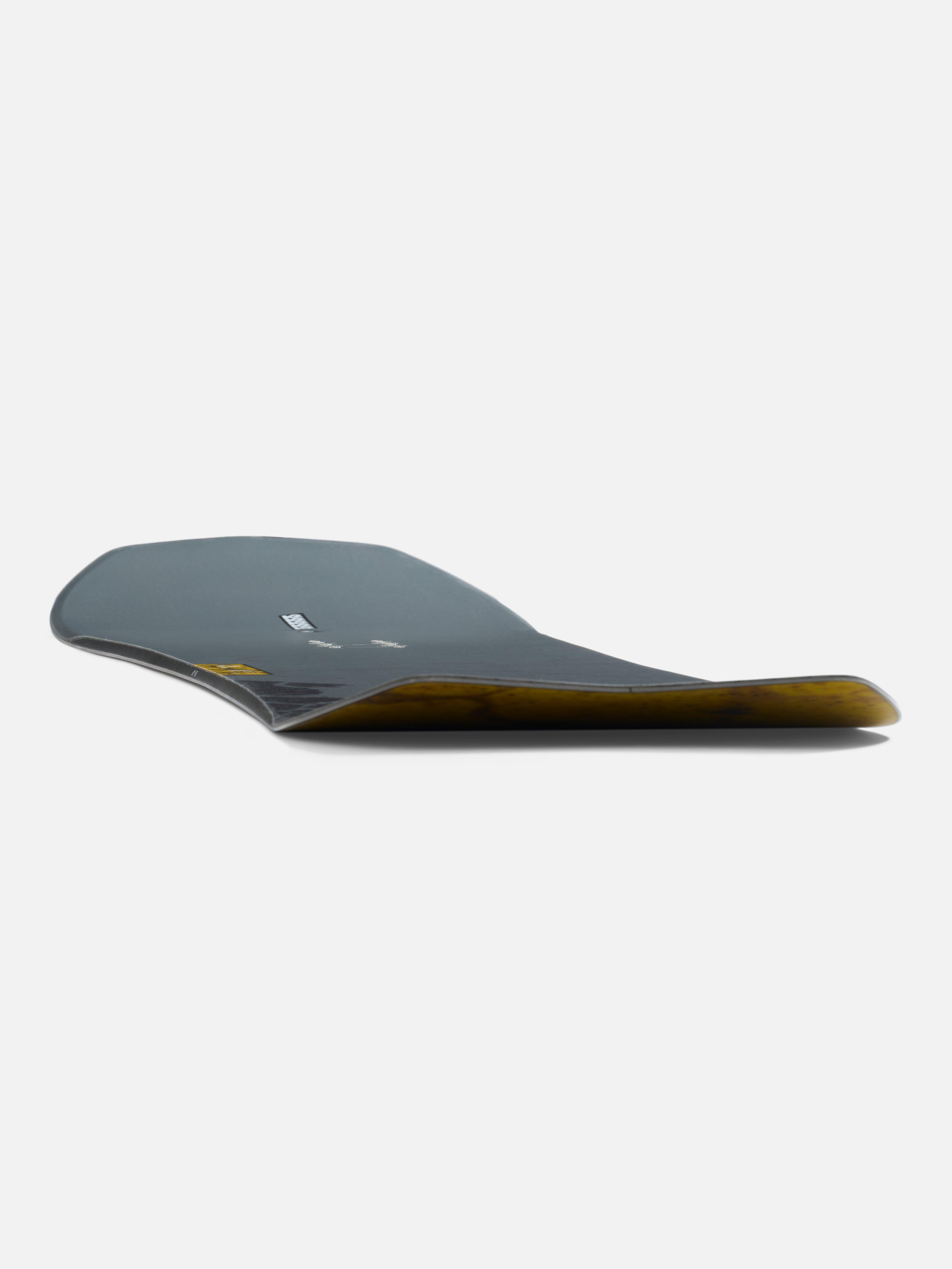 K2 Excavator Snowboard 2027 shown at a low angle, featuring a sleek design suitable for all-mountain snowboarding.