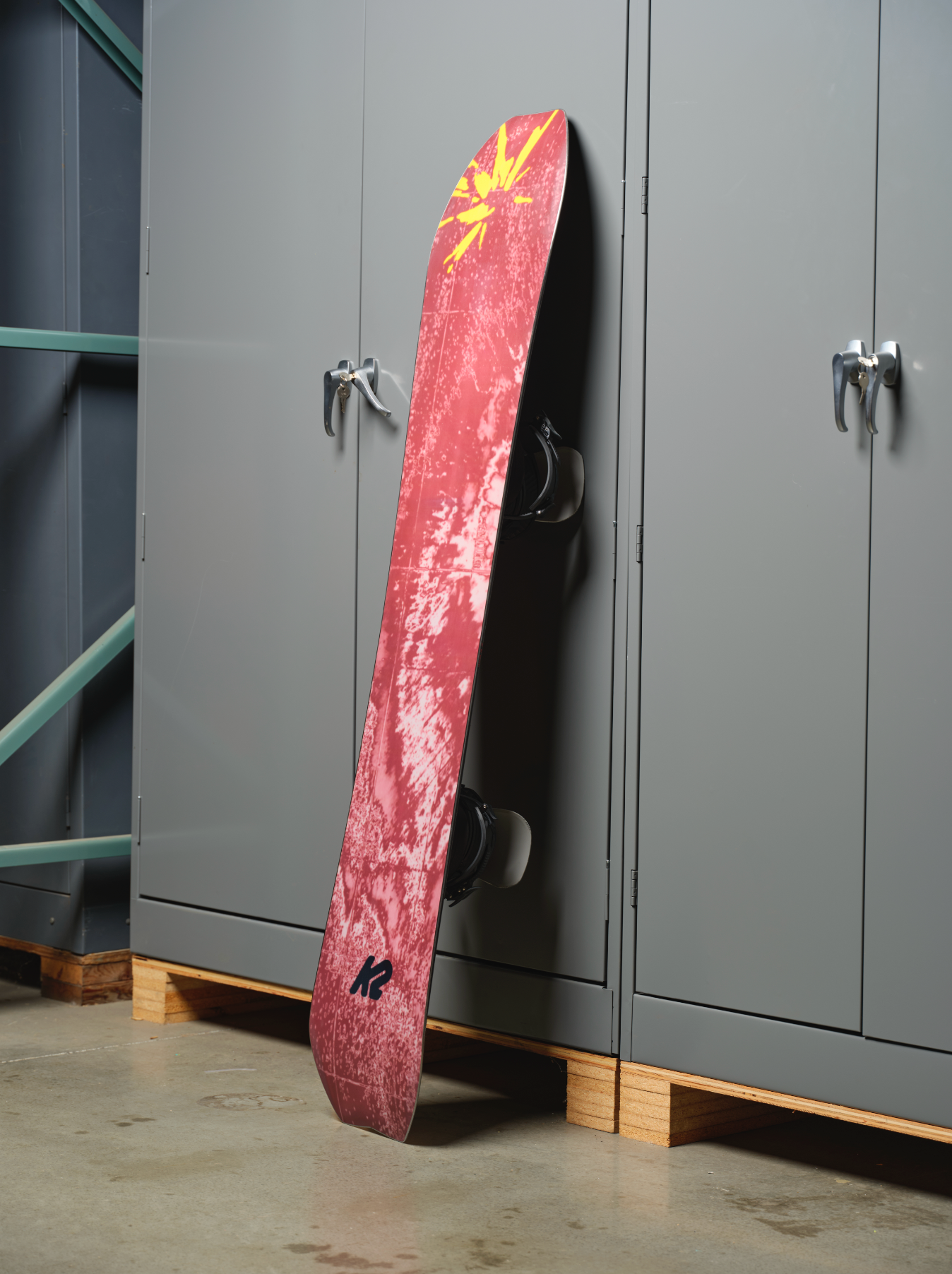 K2 Sky Pilot snowboard with a blue base and factory Milosport graphics, designed for winter snowboarding adventures.