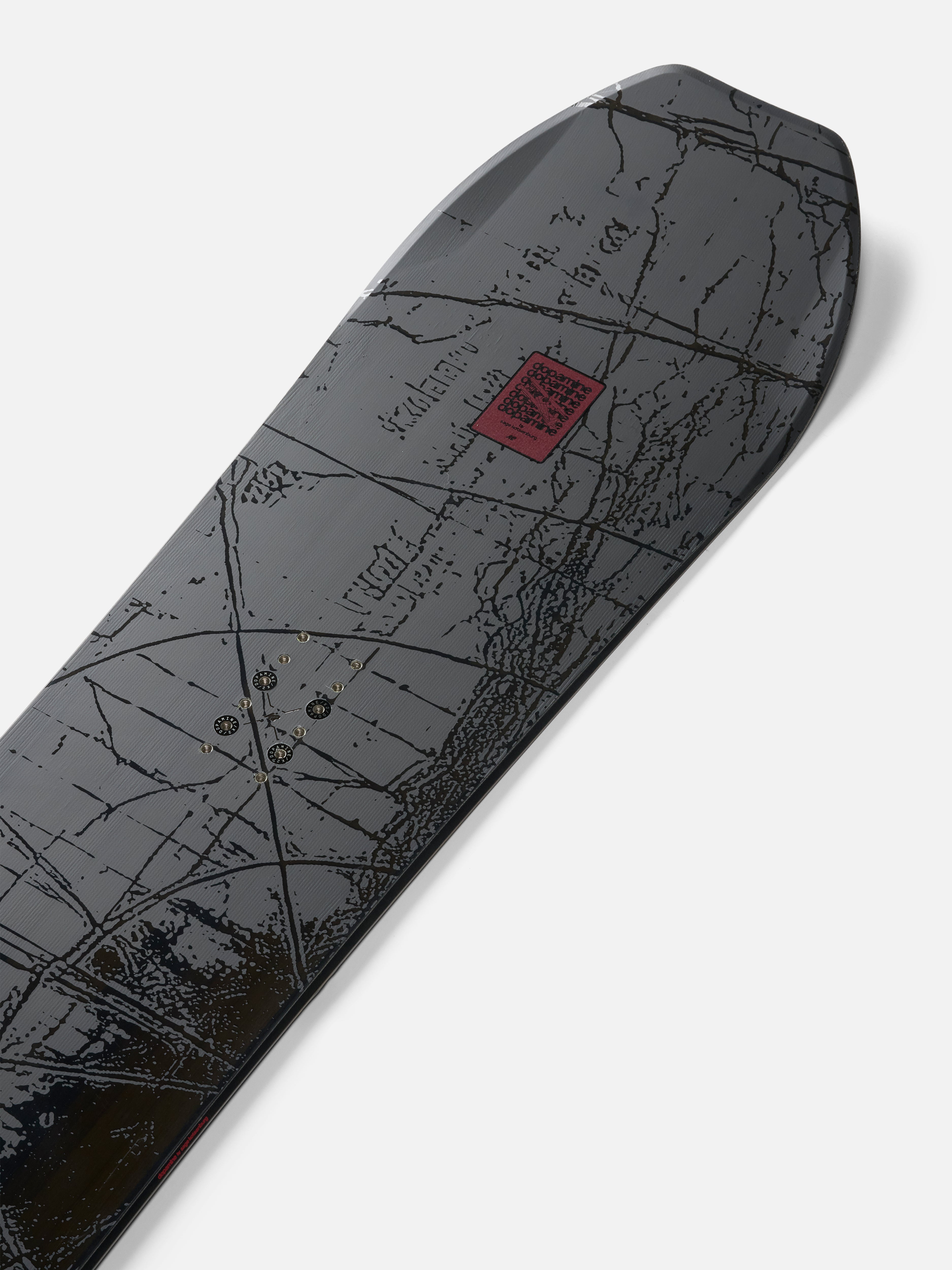 K2 Sky Pilot snowboard with a snowy mountain background, showcasing the nose design of the 2027 K2 snowboarding equipment.