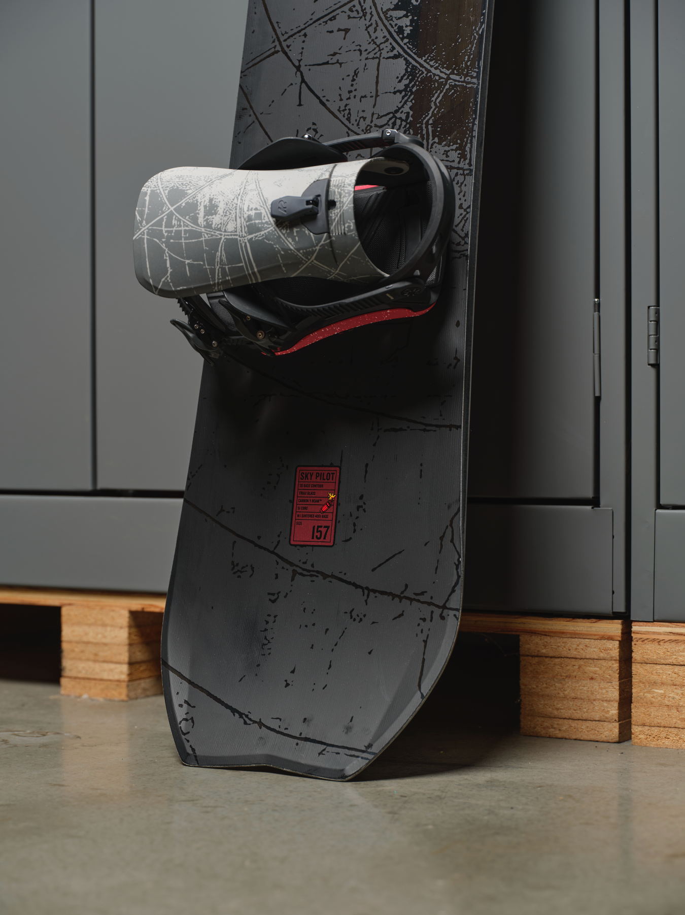 K2 Sky Pilot snowboard 2027 with a close-up of the tail design, showcasing the K2 branding and snowboarding features.