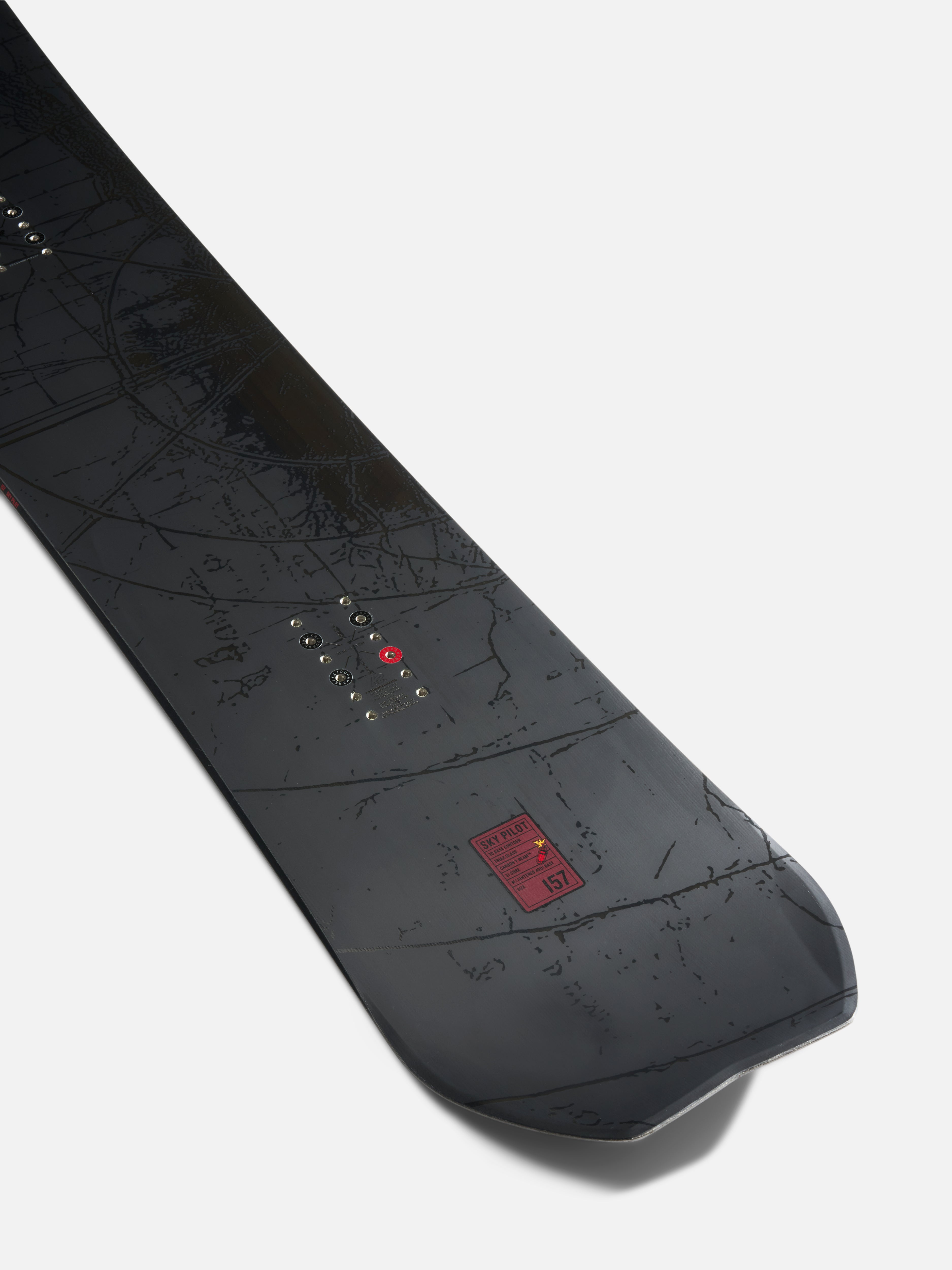 K2 Sky Pilot snowboard's tail with bindings attached, showcasing its sleek design and durable construction for winter snowboarding.