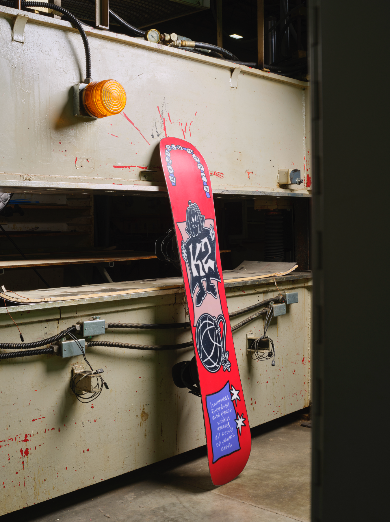 K2 World Peace snowboard 2027 with colorful base design, showcasing the K2 brand and detailed graphic artwork.