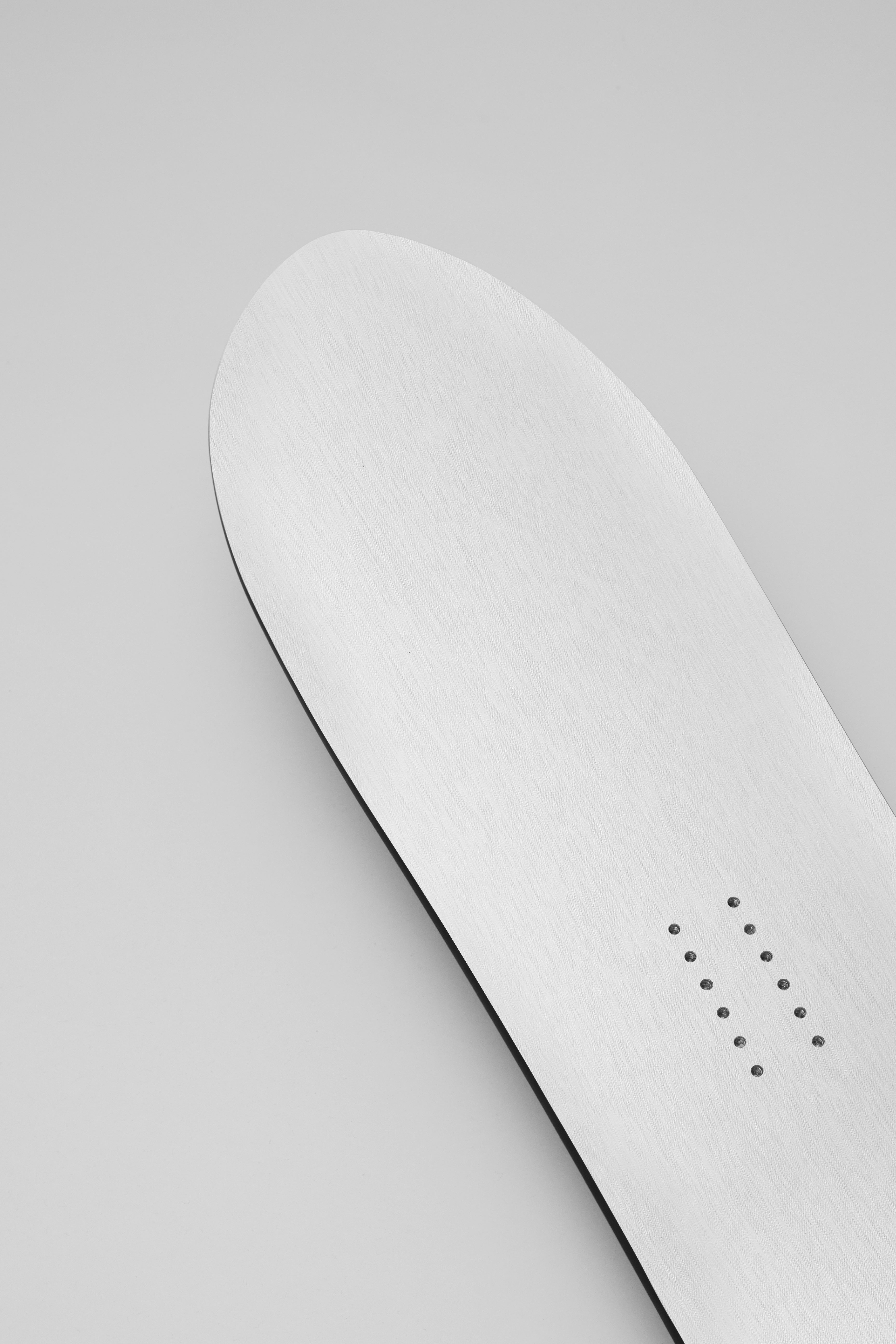 Korua Apollo Snowboard in studio, showing the nose and deck design, designed for snowboarding adventures.