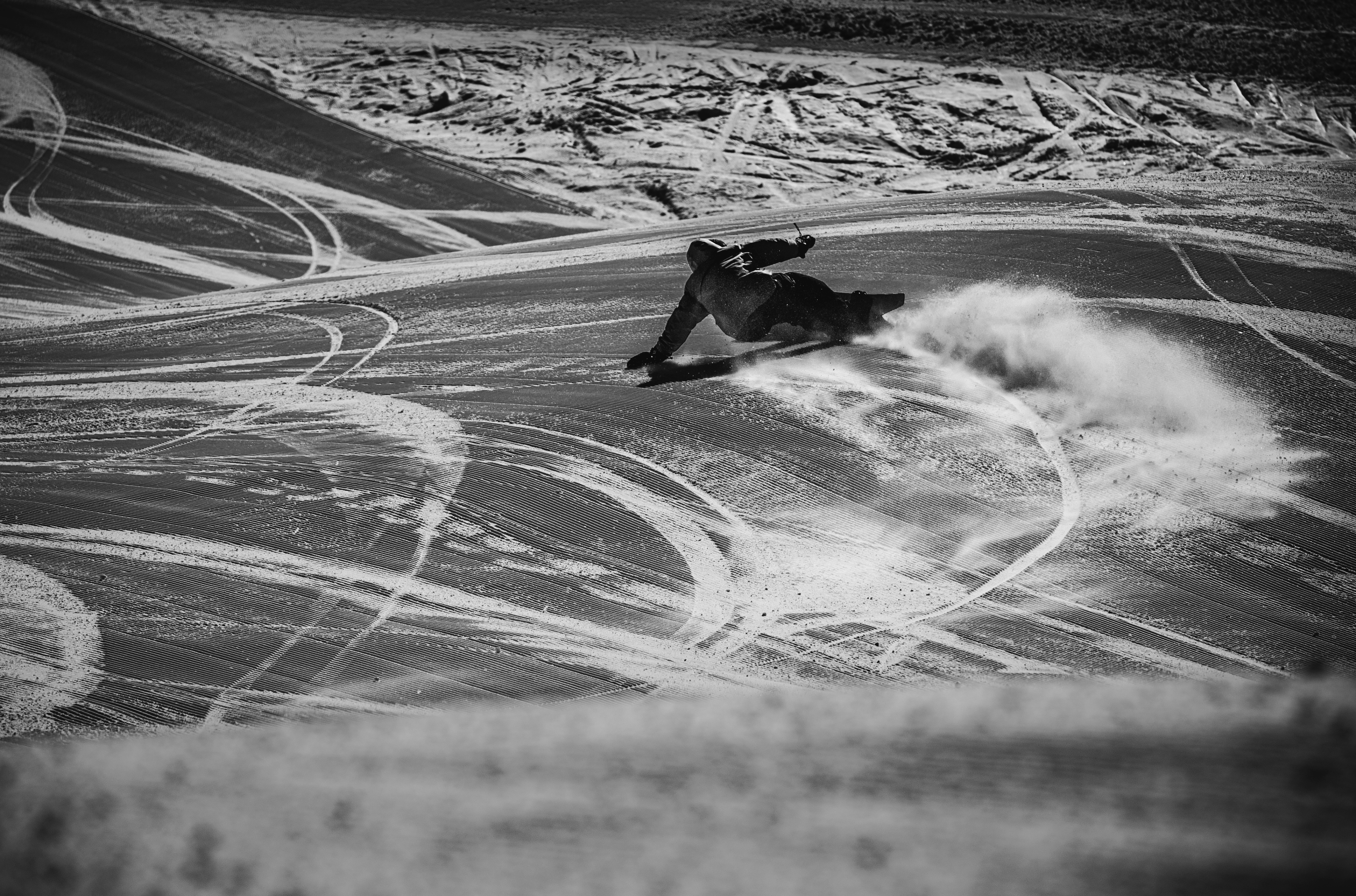 Korua Dart snowboard in snow, featuring a sleek design and vibrant colors, ready for winter snowboarding adventures.