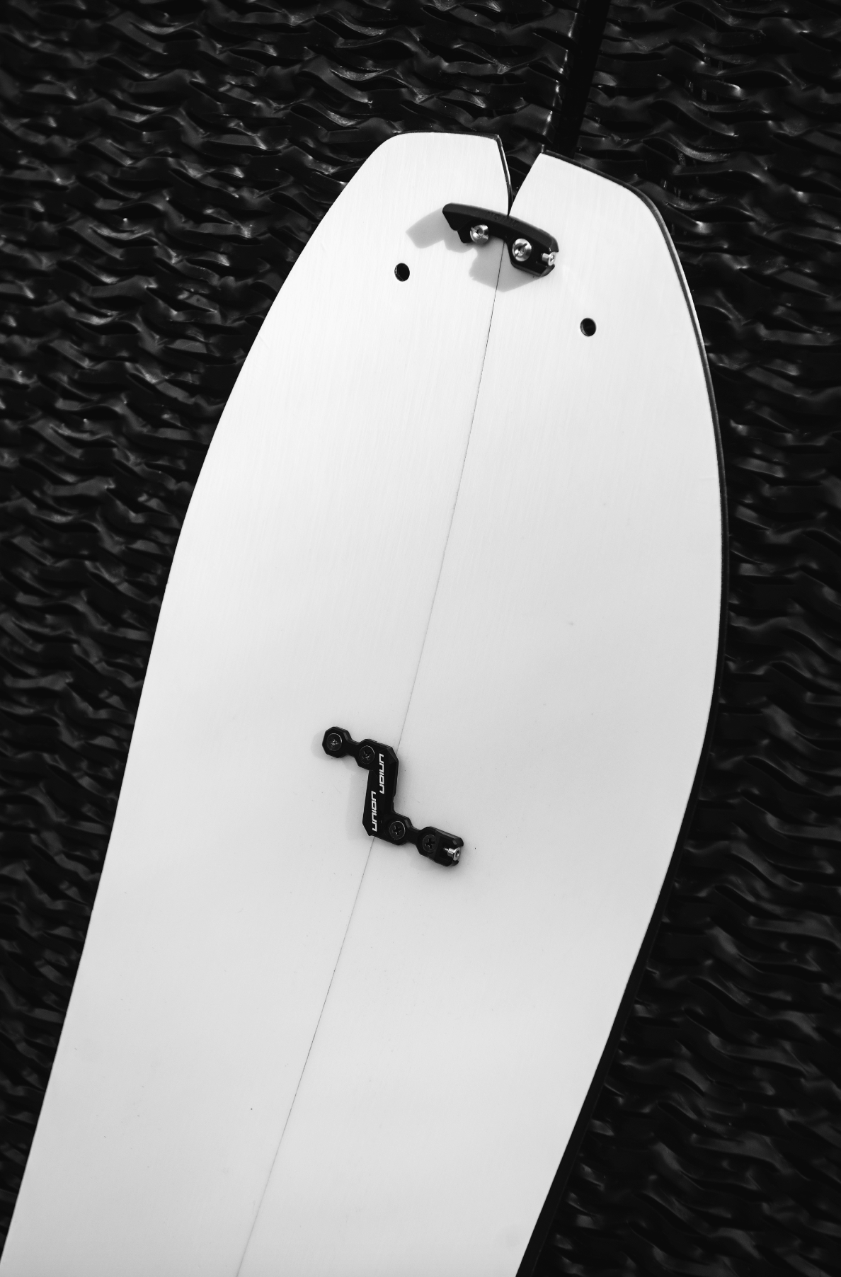 Korua Elevator Split Plus snowboard with distinctive nose design, shown on snow, built for performance and durability.