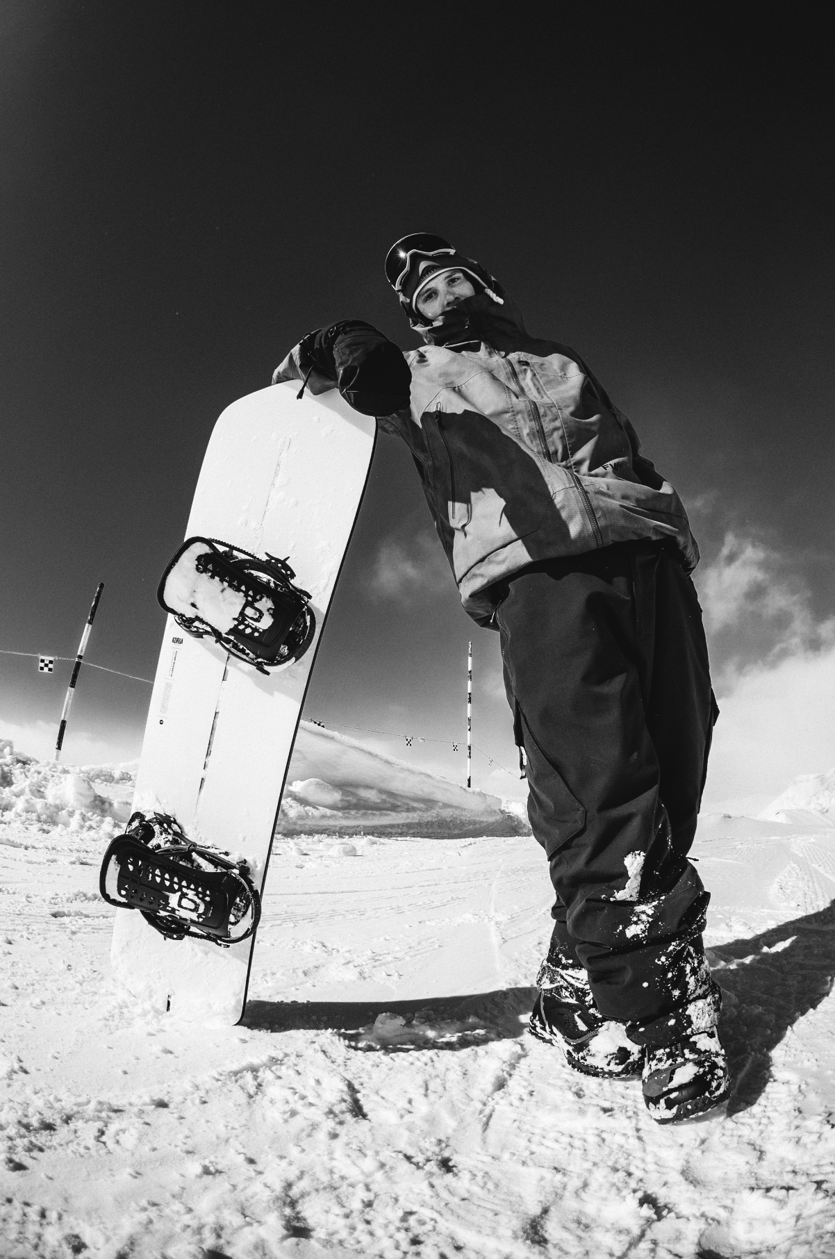 Korua Pocket Rocket snowboard standing upright, showing its compact shape and design, designed for winter snowboarding fun.