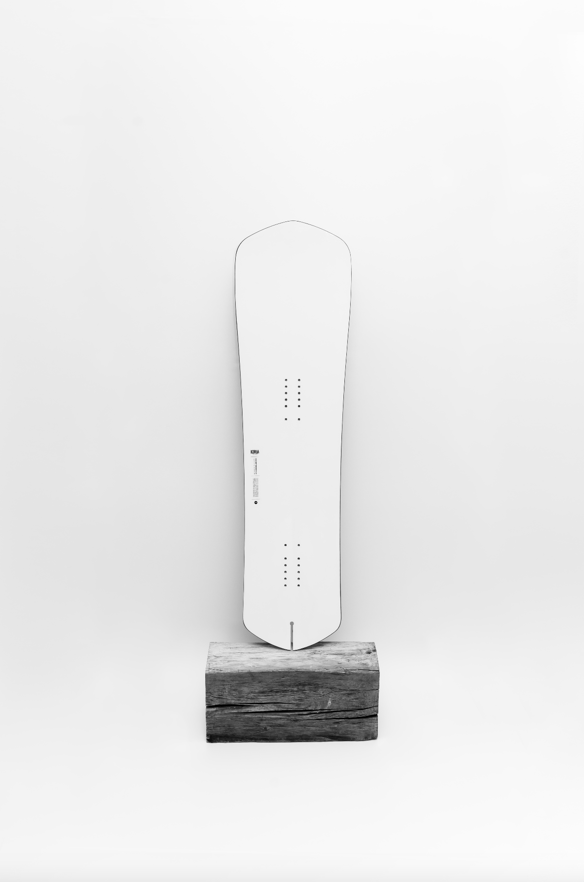 Korua Pocket Rocket snowboard in a studio setting, showcasing its shape and design for snowboarding enthusiasts.
