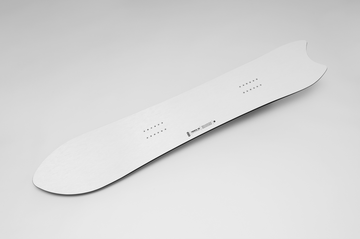 Korua Pencil Junior snowboard with a sleek snow design, featuring the Korua brand logo and detailed graphic artwork.