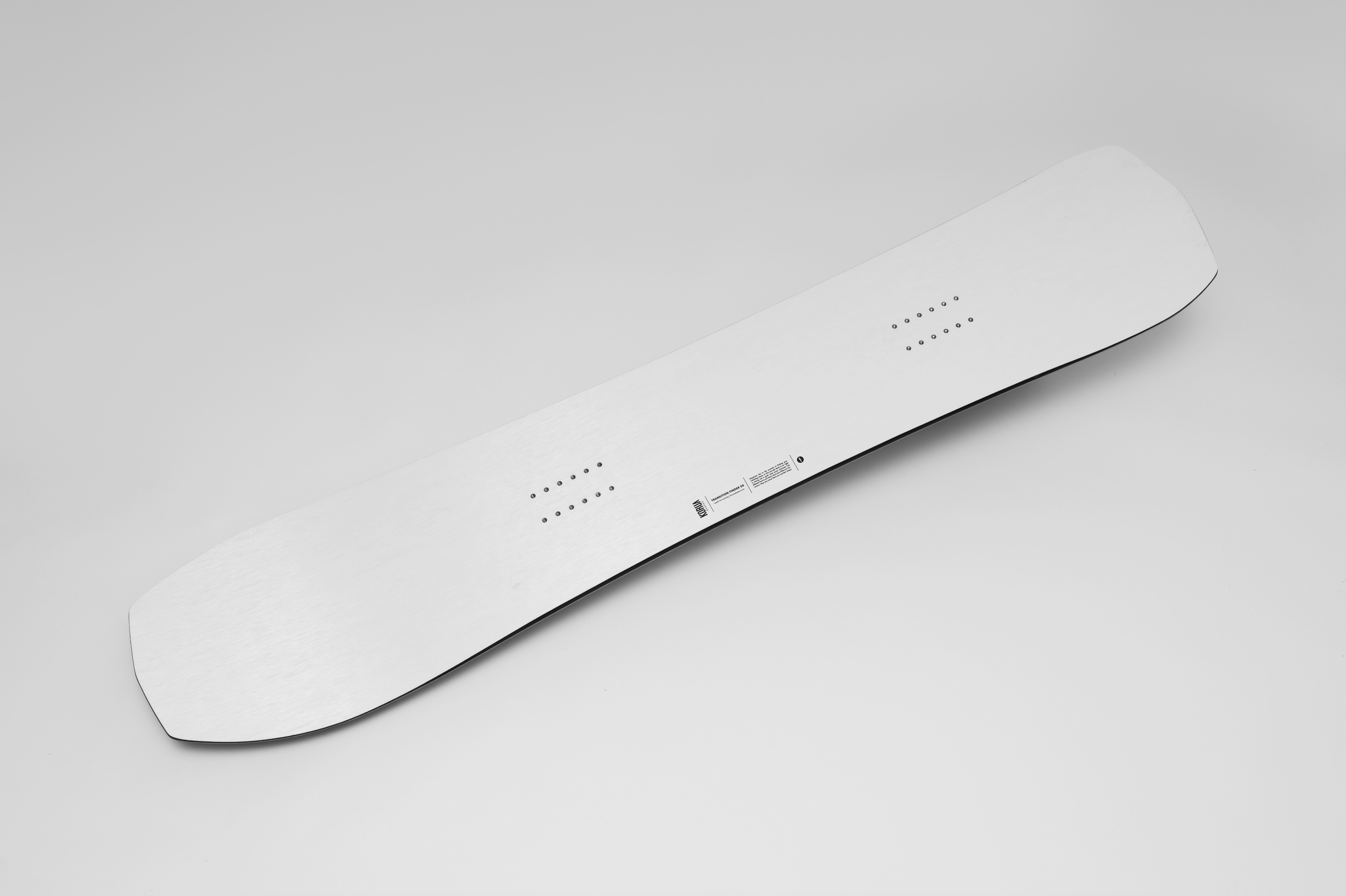 Korua Transition Finder snowboard in snow, showcasing its unique shape and design