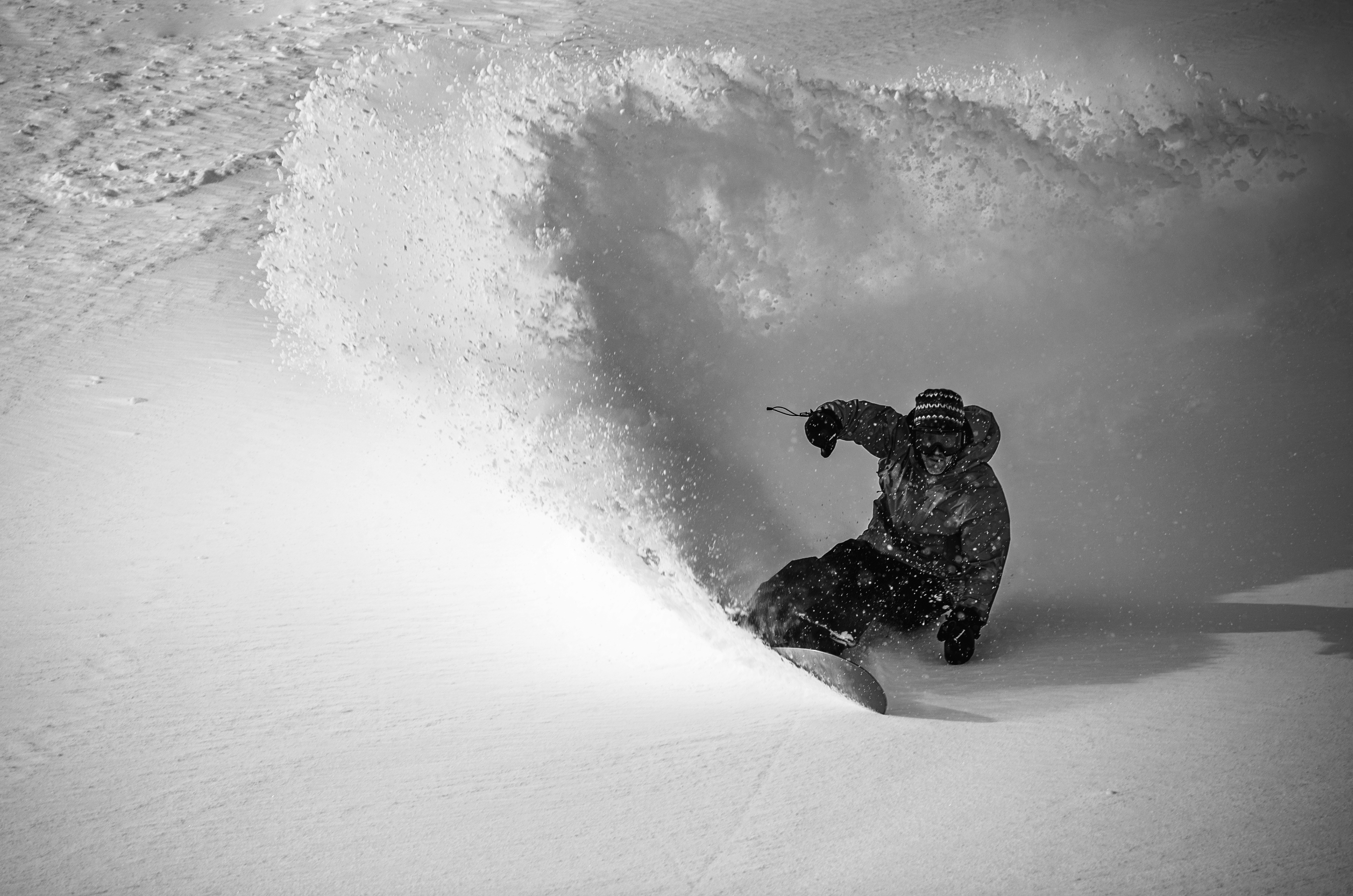 Close-up of Korua Uberegg snowboard showcasing its design and shape on a snowy surface, highlighting the Korua brand style.
