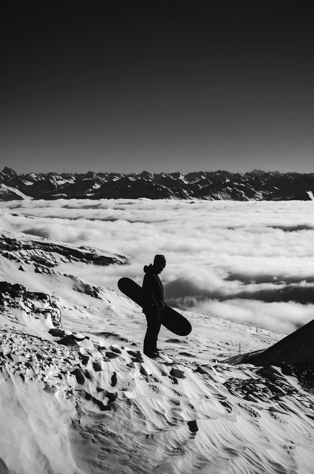 Korua Uberegg snowboard in snow, showcasing the snowboard's unique design and stance in a winter landscape.