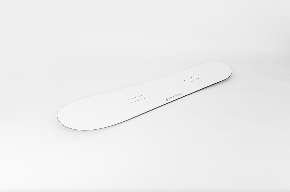 Korua Uberegg snowboard on snow, showing its unique shape and design, ready for winter riding and snowboarding adventures.