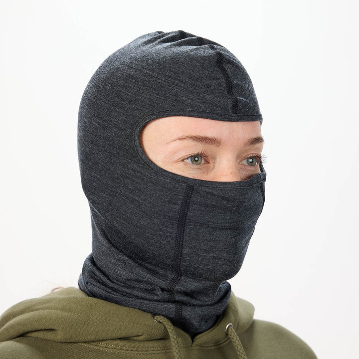 Airblaster Merino Ninja Face 2027 in Black shown from a three-quarter angle with low-profile merino balaclava fit, face opening and full neck coverage.
