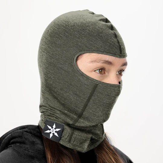 Airblaster Merino Ninja Face 2027 in Resin shown from a three-quarter angle with form-fitting merino construction, face opening, extended neck coverage and Ninja Star label.