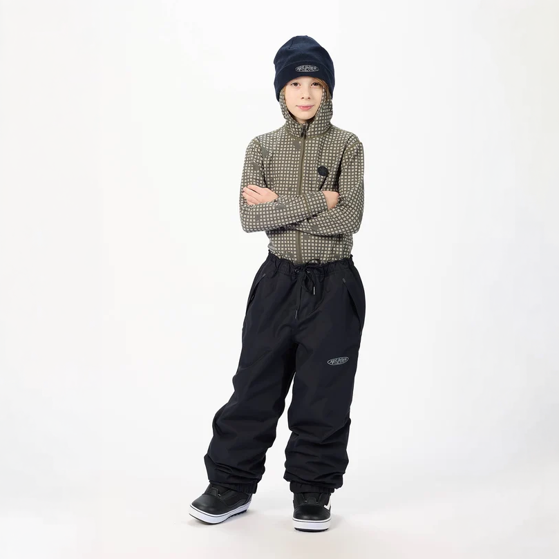 Airblaster Youth Access Pant 2027 in Black shown from a front three-quarter angle with relaxed fit, elastic waist, front pockets and cuffed hems.