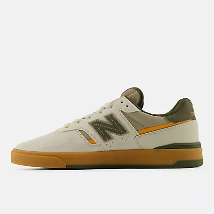 Inner side profile of the New Balance Numeric 306 Cup Foy skate shoe in grey and green with orange accent and gum outsole.