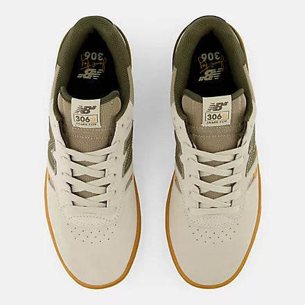 Top view of a pair of New Balance Numeric 306 Cup Foy skate shoes showing cream laces, perforated toes and olive padded collars.