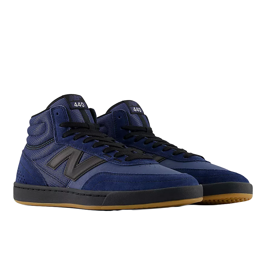 Pair of New Balance Numeric 440 High V2 skate shoes in Vintage Indigo and Black shown from a front three-quarter angle with black laces and gum outsoles.