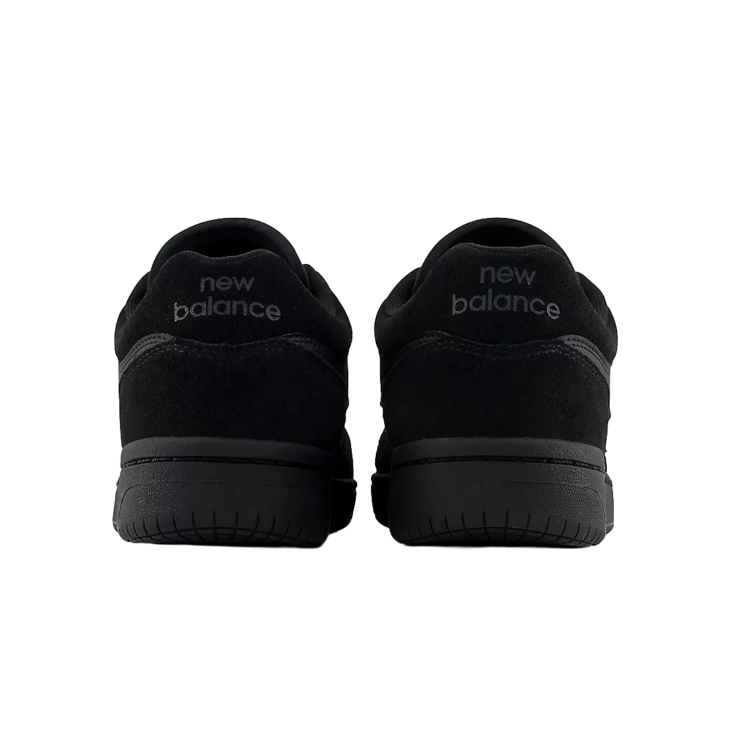 Rear view of a pair of New Balance Numeric 480 skate shoes in Black and Black with New Balance heel branding.