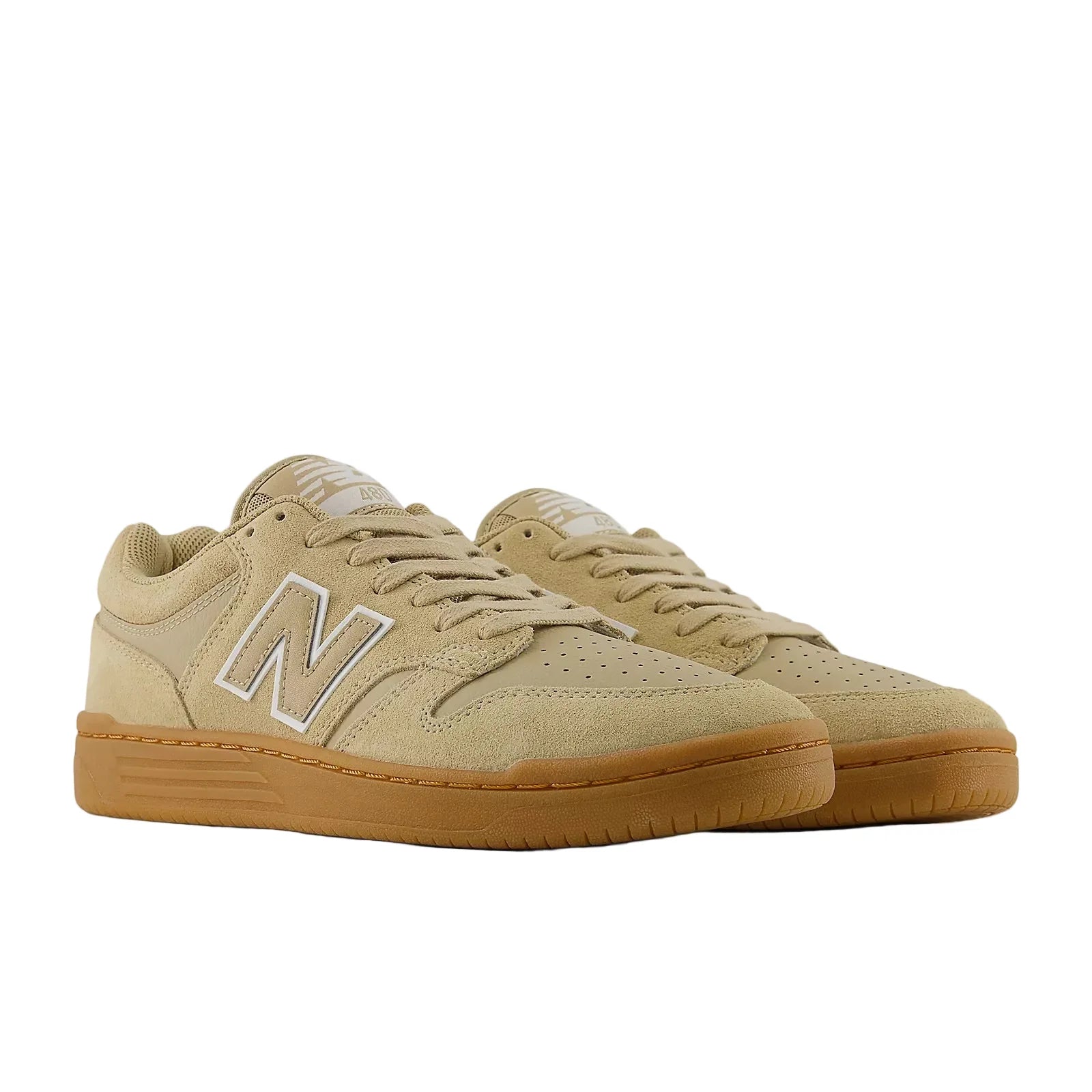 Pair of New Balance Numeric 480 skate shoes in Incense and White shown from a front three-quarter angle with gum cupsoles.