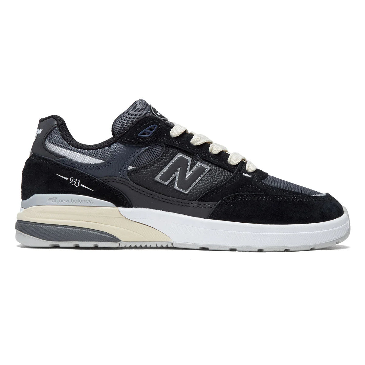 New Balance Numeric 933 Andrew Reynolds skate shoe in black and navy, outer side profile with suede and mesh upper, cream laces and white cupsole.
