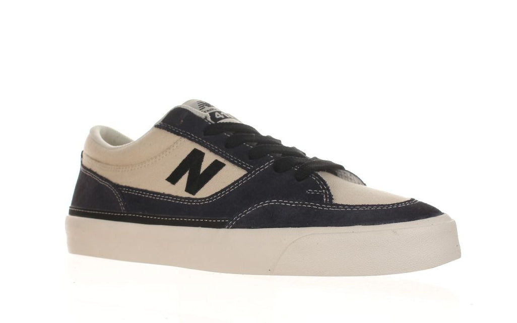 Inner side profile of the New Balance Numeric Franky Villani 417 Low in Eclipse and White with navy suede, cream upper and white vulcanized sole.