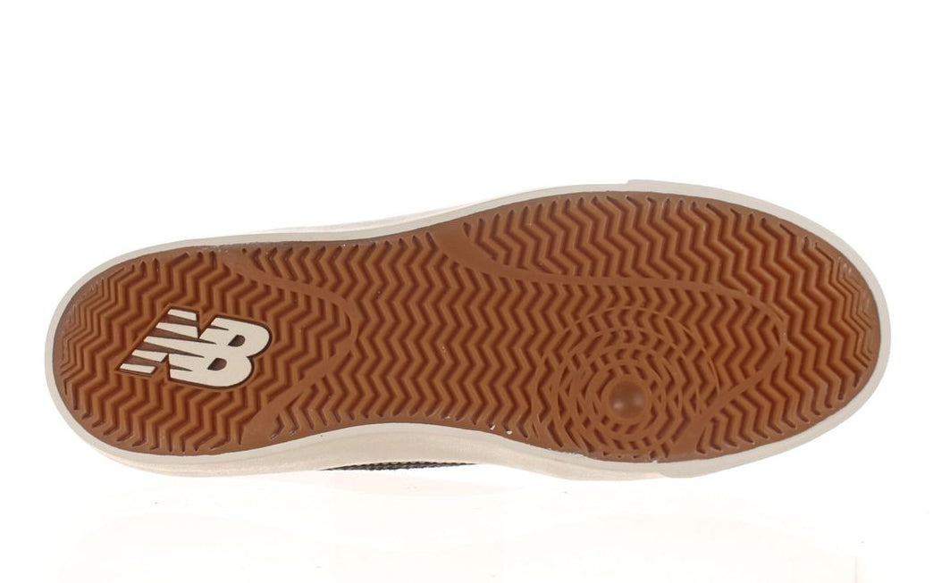 Bottom view of the gum rubber outsole and herringbone traction pattern on the New Balance Numeric Franky Villani 417 Low skate shoe.