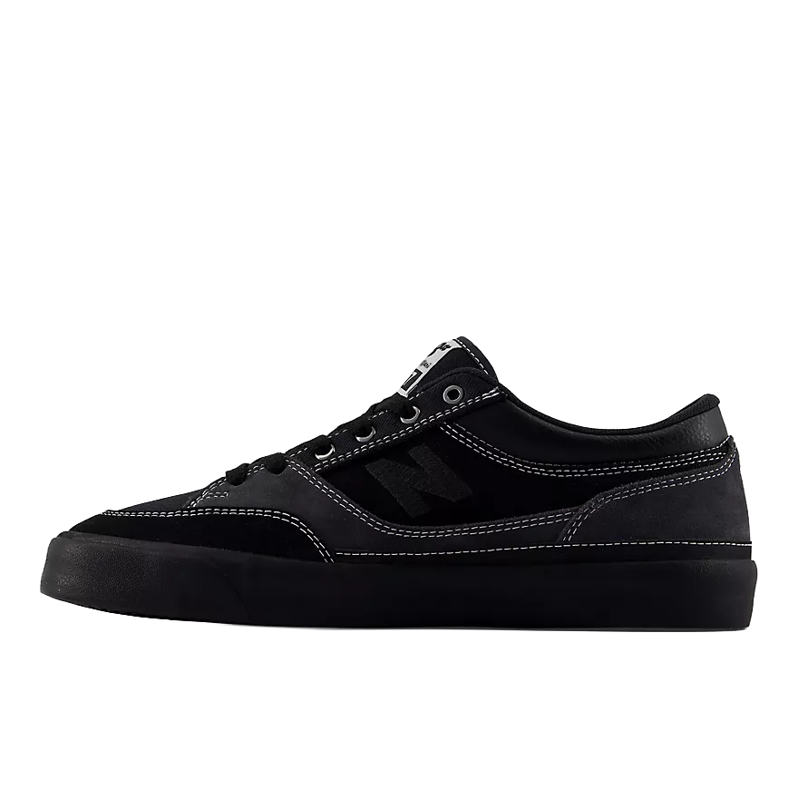 Inner side profile of the New Balance Numeric Franky Villani 417 Low in grey and black with dark suede upper, tonal N logo and black vulcanized sole.
