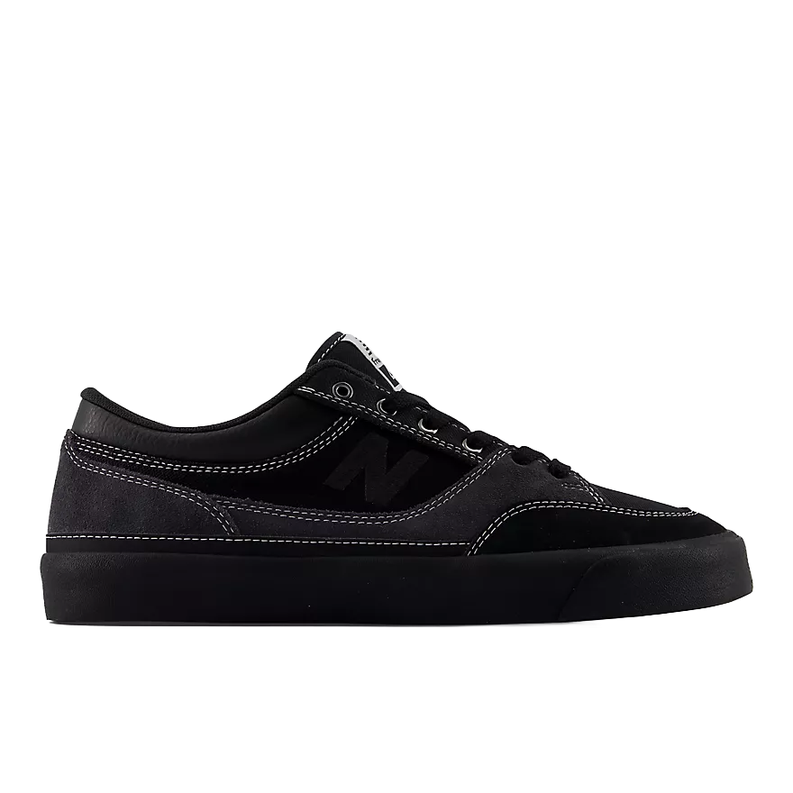 New Balance Numeric Franky Villani 417 Low skate shoe in grey and black, outer side profile with dark suede upper, contrast white stitching and black vulcanized sole.