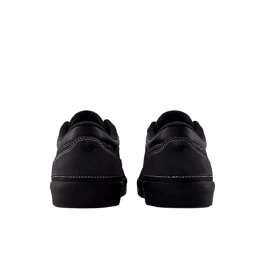 Rear view of a pair of New Balance Numeric Franky Villani 417 Low skate shoes showing grey suede heel panels, tonal New Balance branding and black vulcanized soles.