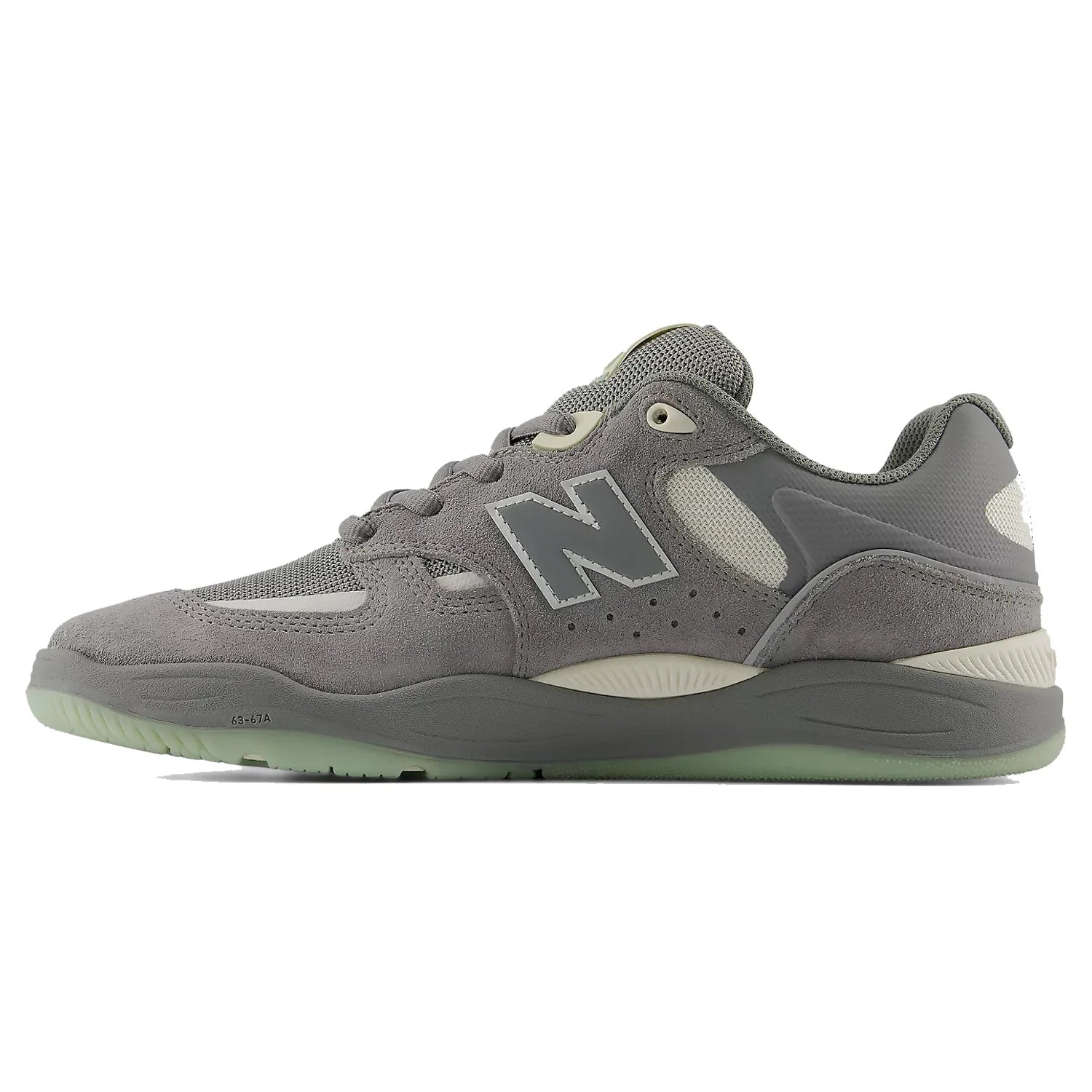 Inner side profile of the New Balance Numeric Tiago 1010 in Slate Grey and Sea Salt with suede overlays, mesh panels and cushioned cupsole.