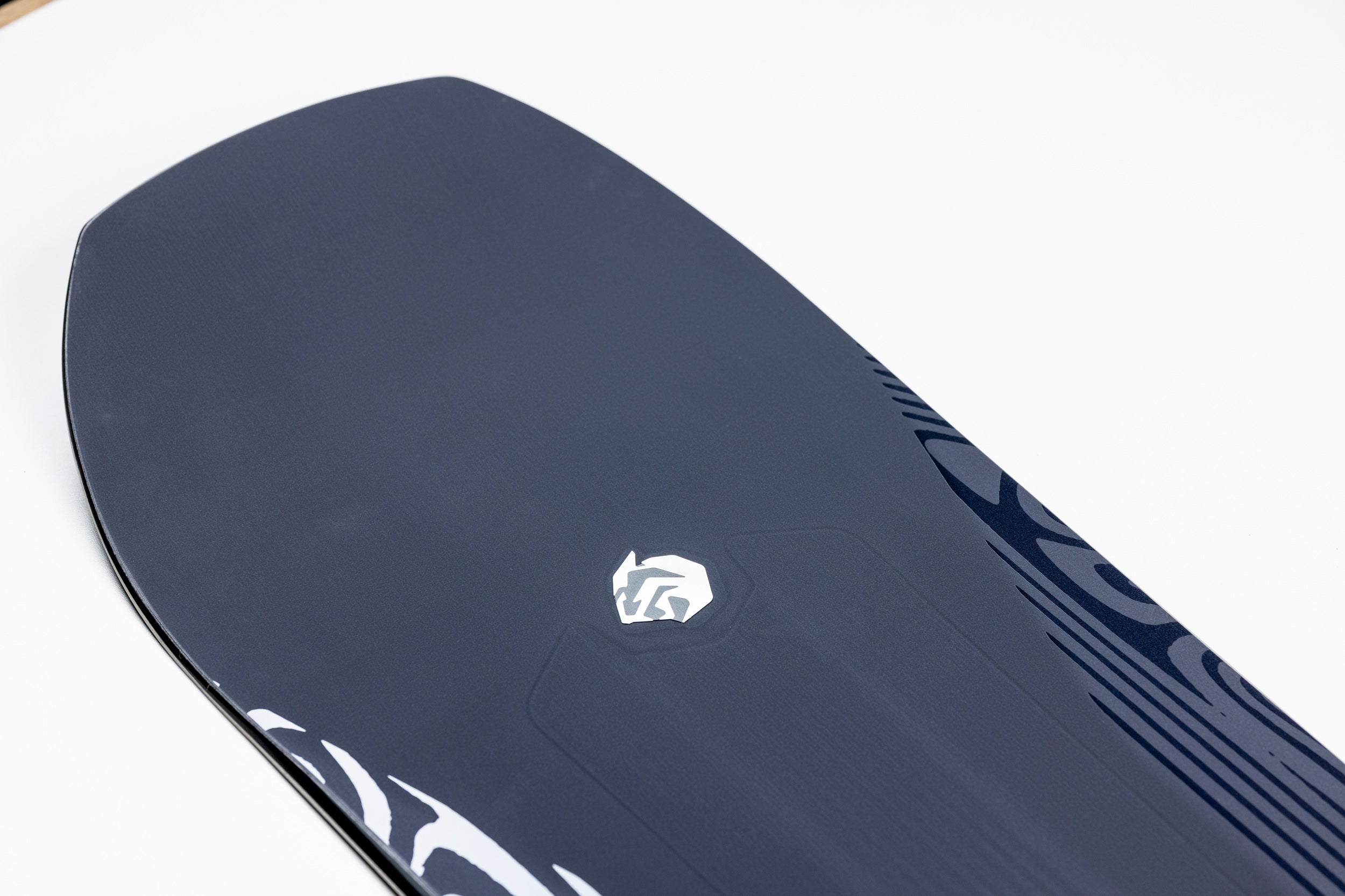 Close-up of the nose logo on the Nitro Pantera Snowboard 2027, showcasing its sleek design and branding details.