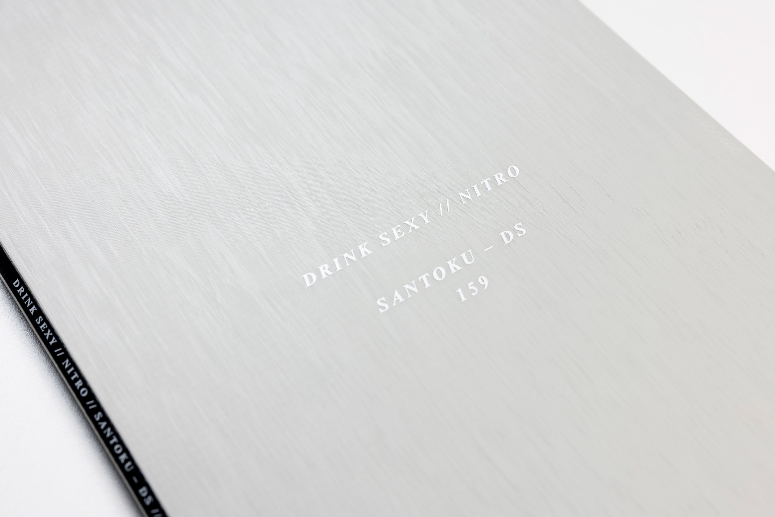 Nitro Santoku Snowboard 2027 with detailed topsheet branding, designed for snowboarding adventures and performance on snow.