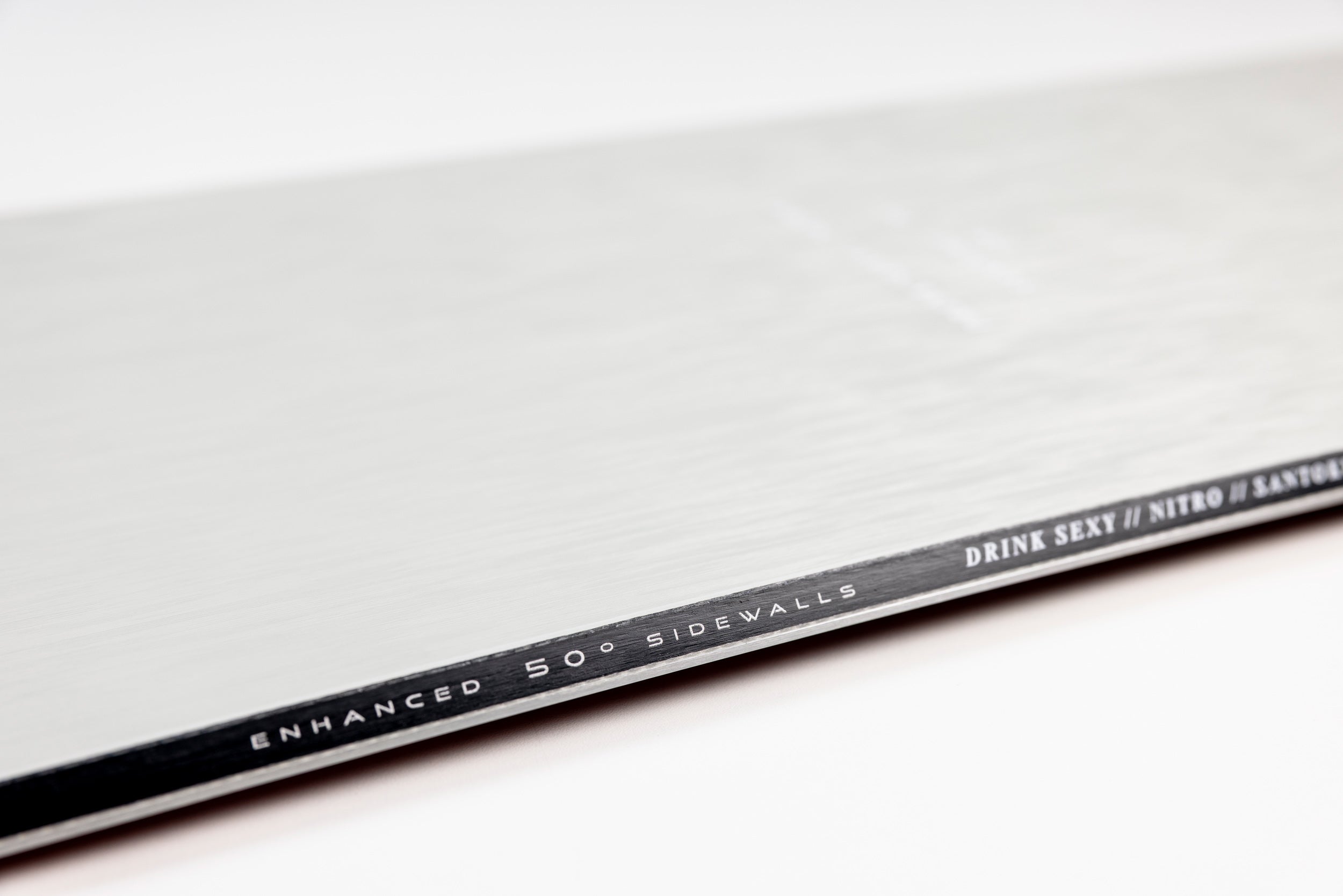 Nitro Santoku Snowboard 2027 with 50-degree sidewalls, designed for snowboarding, featuring a sleek black and white graphic.