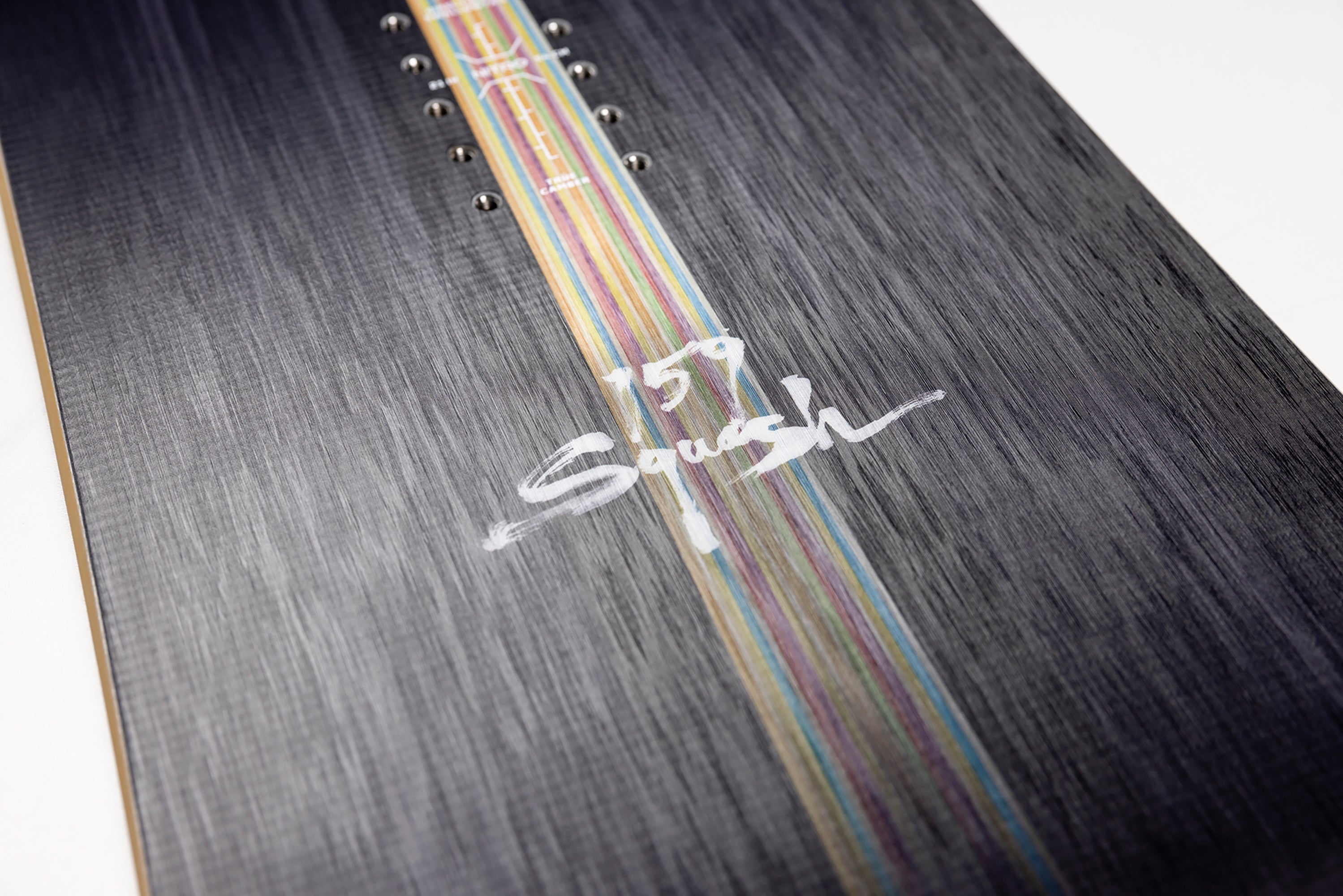Close-up of Nitro Squash Snowboard 2027 showing branding detail and snowboard design on a snowy surface.