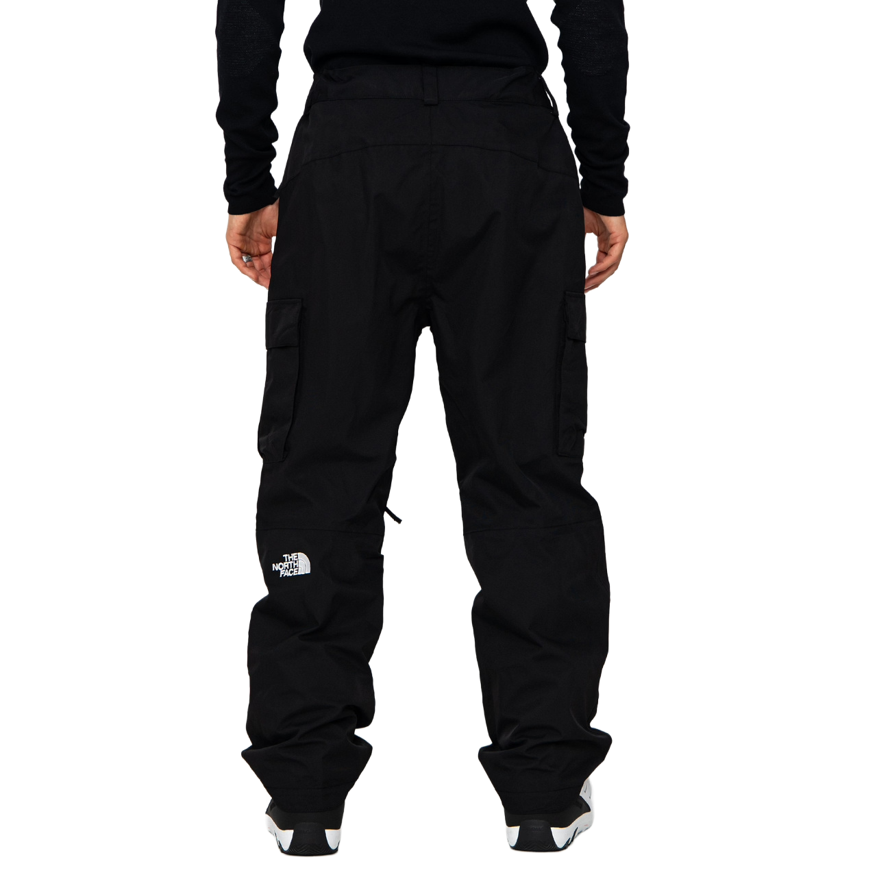 Rear view of The North Face Men’s Blizzardery Cargo Pants in TNF Black showing the relaxed fit, cargo pocket profile and embroidered The North Face logo.
